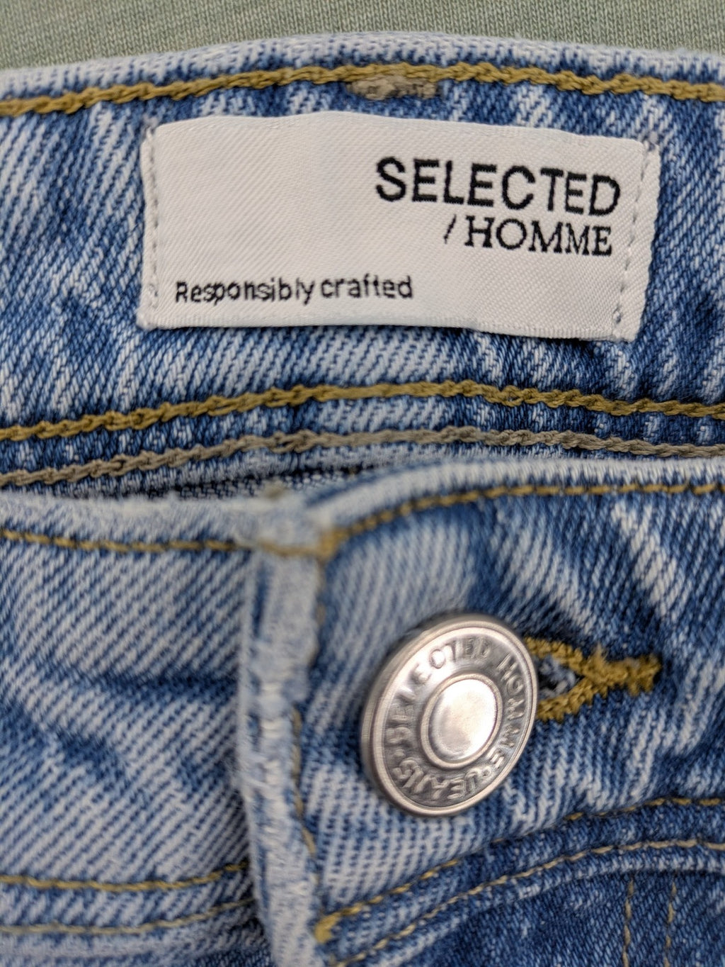 Selected Homme blue slim fit jeans with classic wash and stretch cotton material.