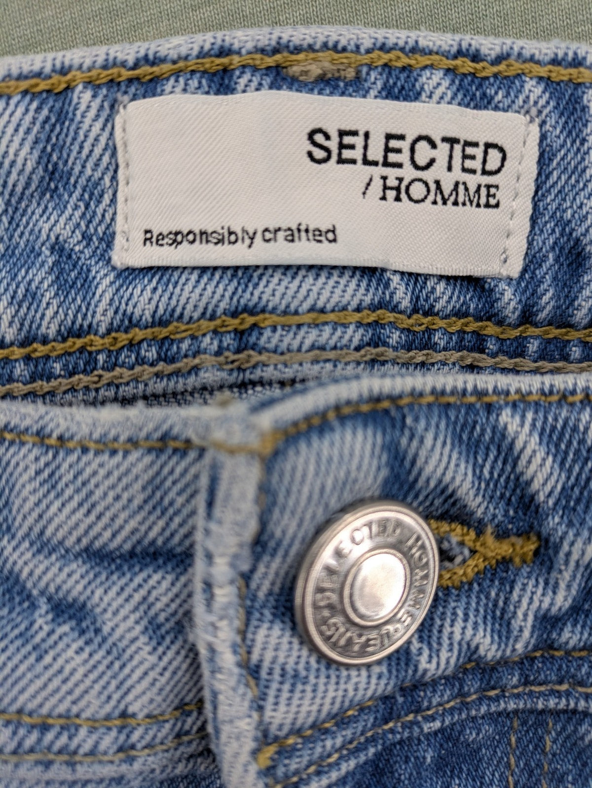 Selected Homme blue slim fit jeans with classic wash and stretch cotton material.