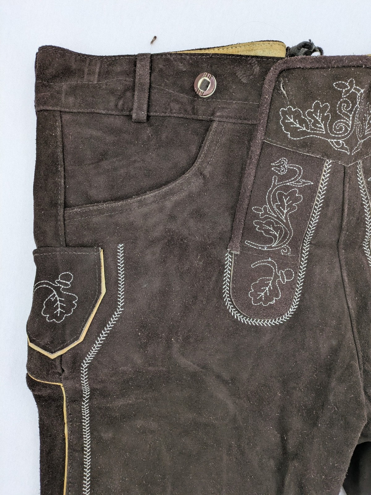 Braun traditional leather pants brown suede with intricate embroidery on bib and legs.