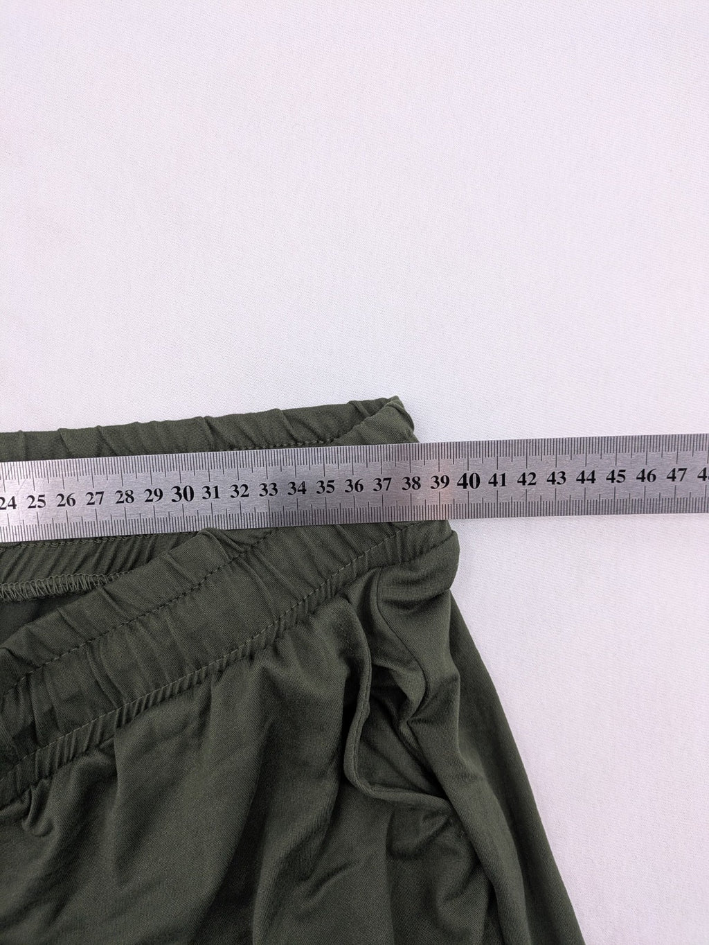 Infinity green jogger pants with elastic waistband and side pockets, soft stretch material.