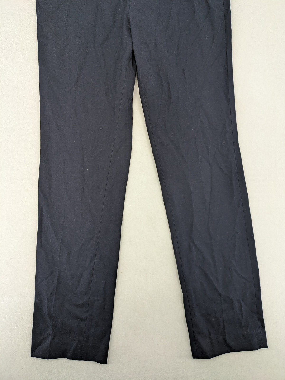 H&M navy slim fit executive suit trousers with flat-front design and side pockets.