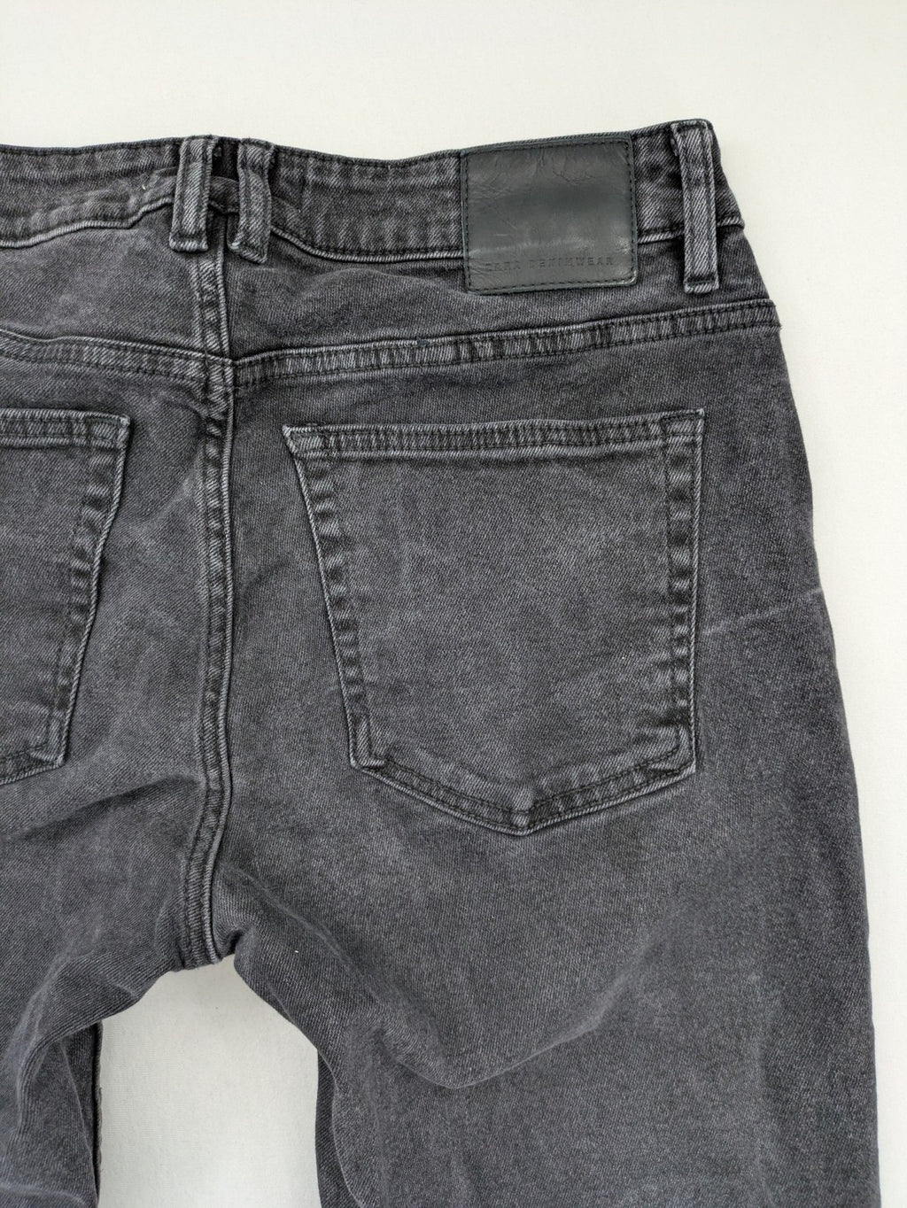 Zara black straight jeans faded wash five-pocket design with zipper closure.