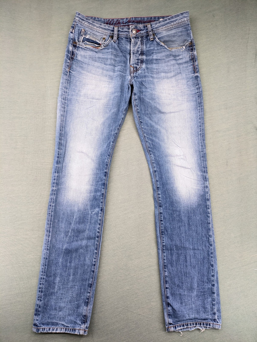 Pepe Jeans blue straight jeans with Union Jack embroidery and distressed denim finish.