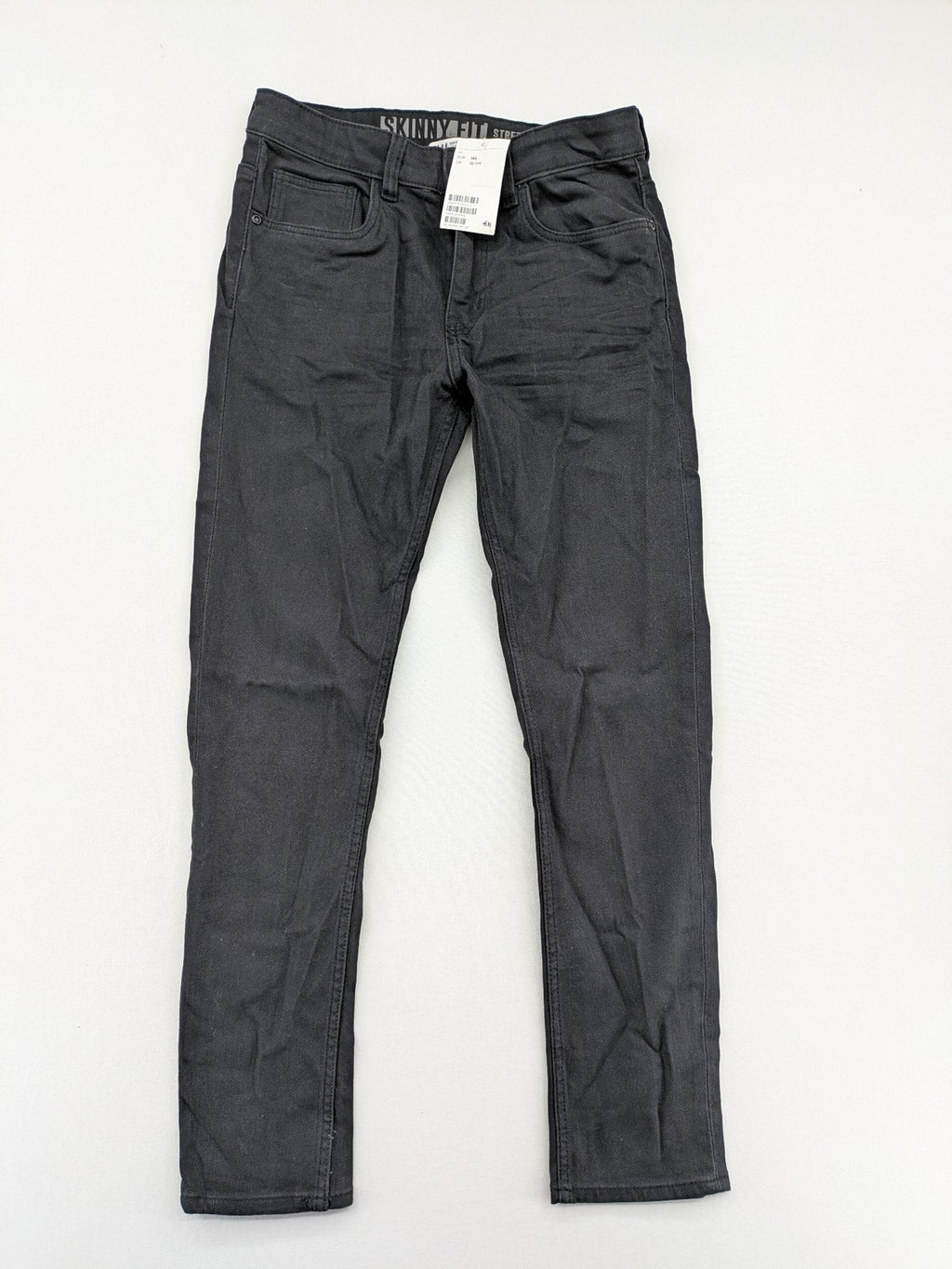H&M grey skinny fit stretch jeans with modern design and durable denim material.