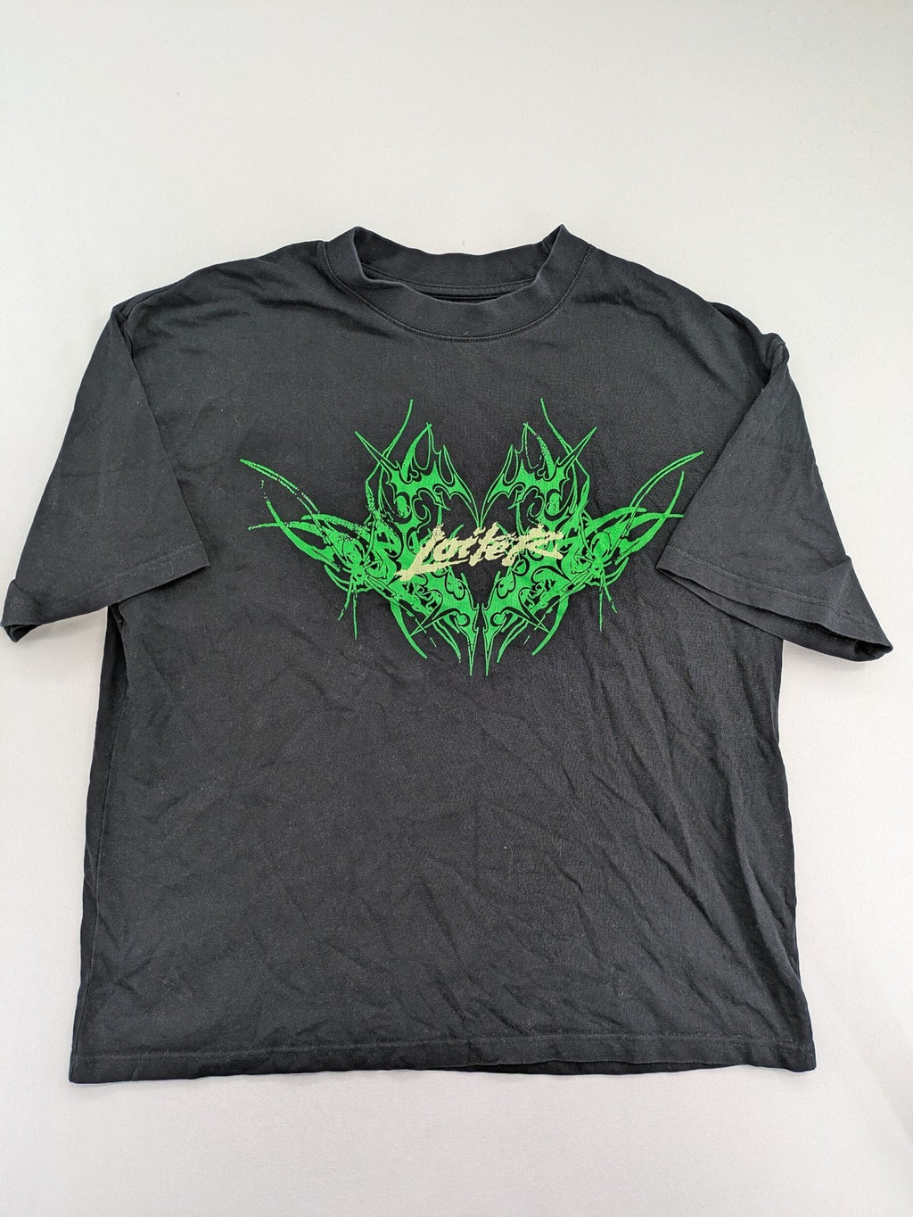 Lotter XL t-shirt black with neon green tribal graphic print on front and back.