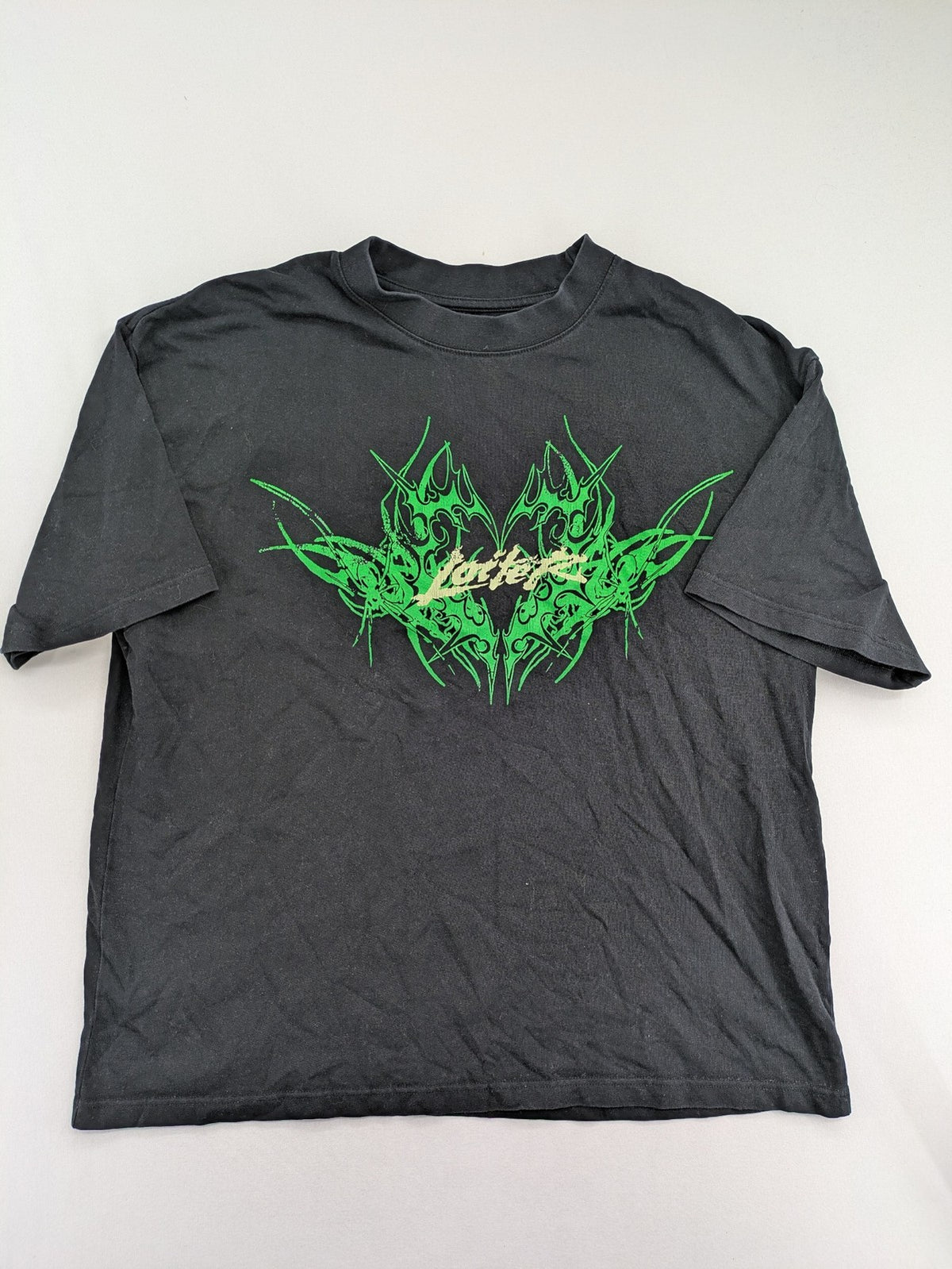 Lotter XL t-shirt black with neon green tribal graphic print on front and back.