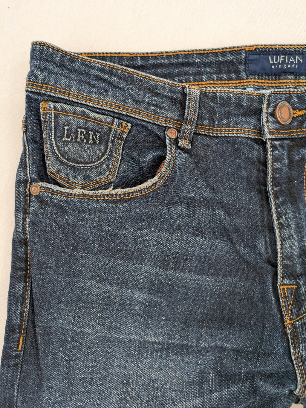 Lufian blue straight jeans dark wash distressed 5-pocket style with stretch denim.