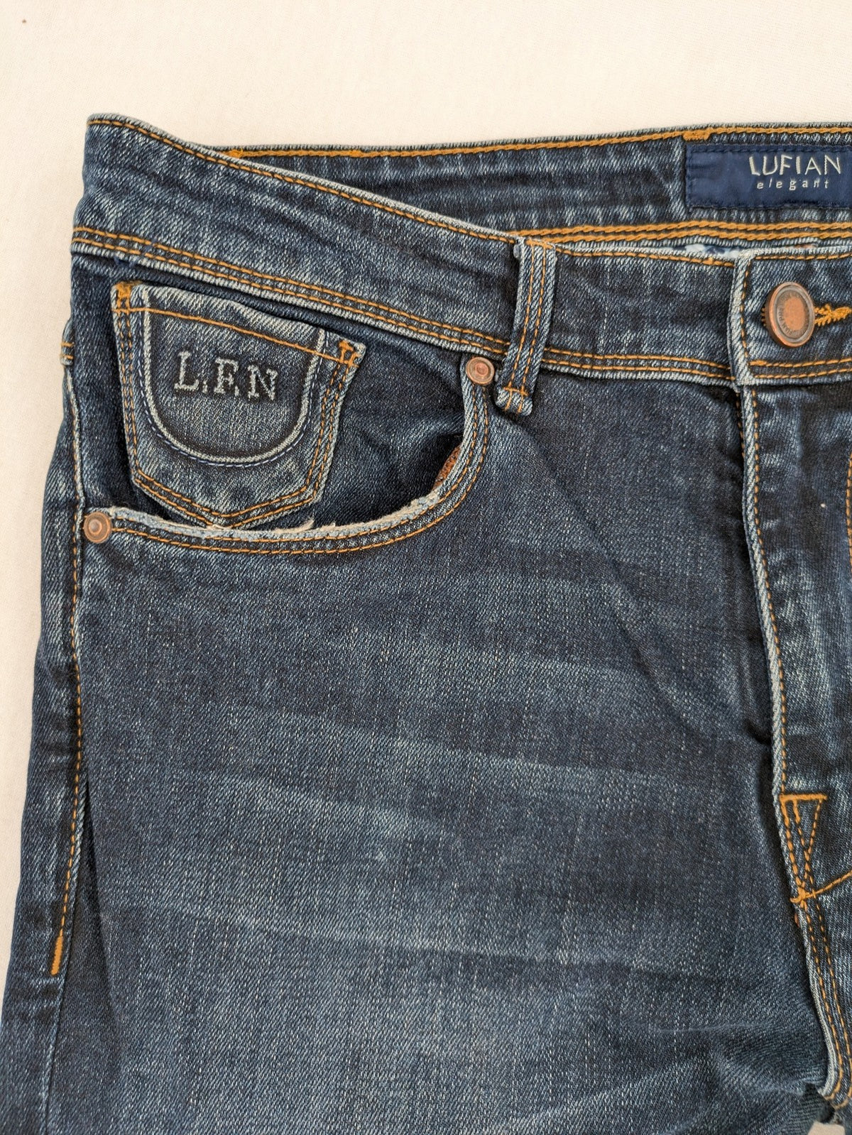 Lufian blue straight jeans dark wash distressed 5-pocket style with stretch denim.