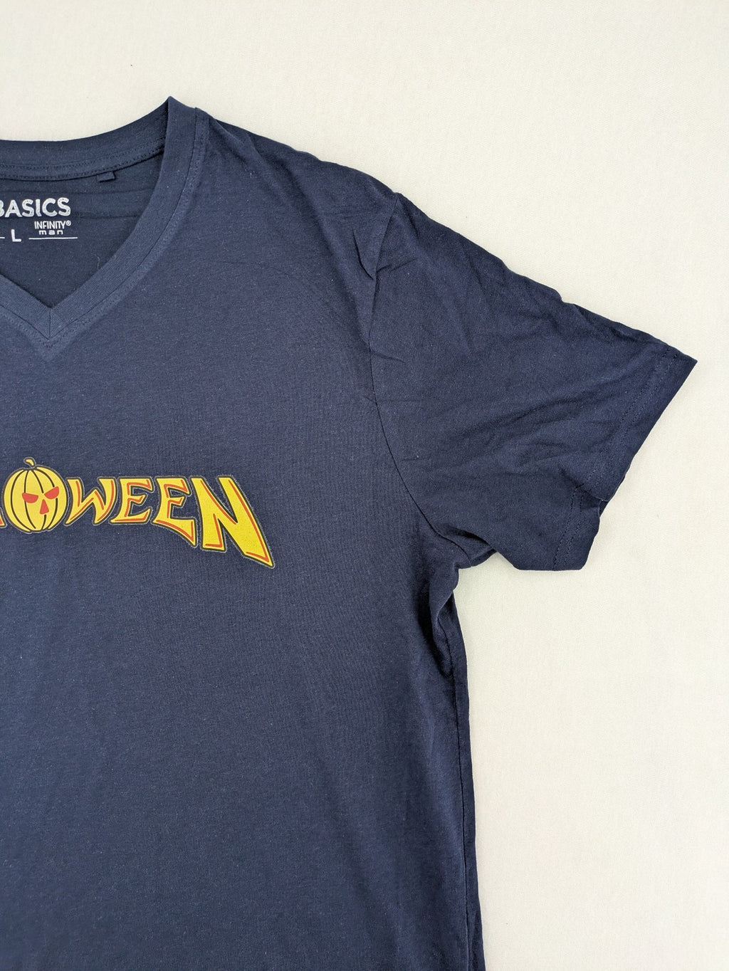 Helloween navy band T-shirt featuring iconic logo and pumpkin graphic, cotton material.