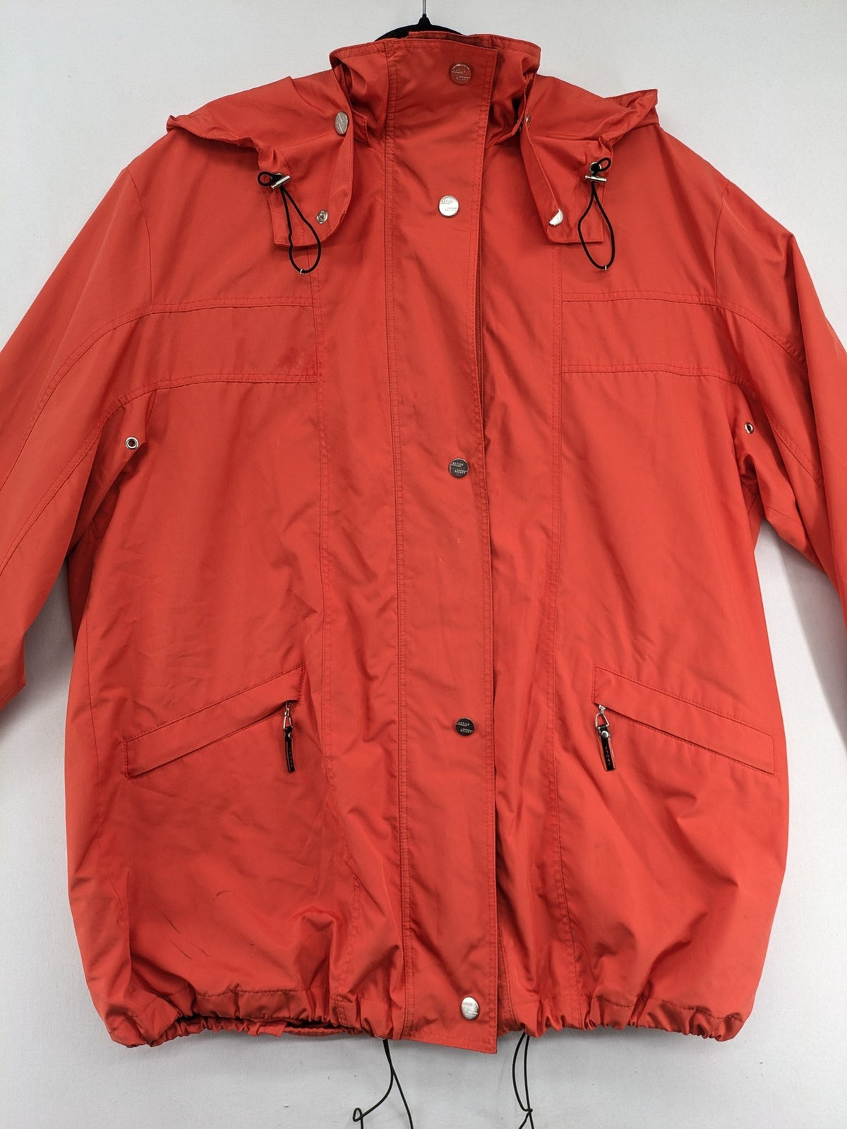 Sport Windbreaker orange jacket with adjustable hood, full zip, and button storm flap.
