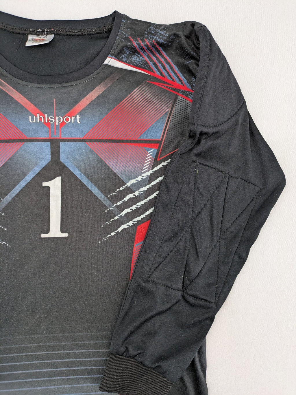 uhlsport long sleeve goalkeeper jersey black with red and blue accents, padded elbows, number 1