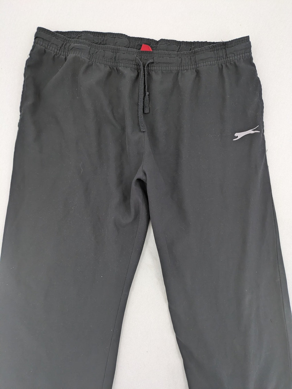 Slazenger grey loungewear joggers with adjustable drawstring and subtle logo on thigh.