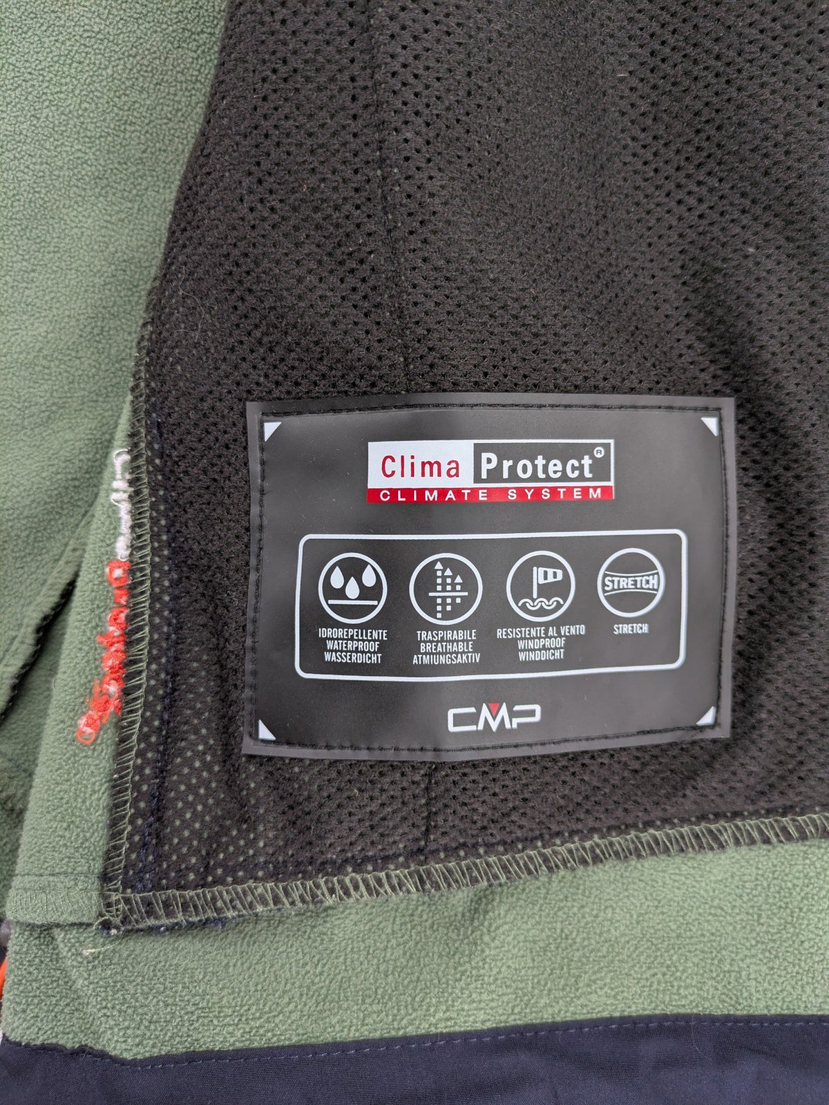 cmp green and navy softshell jacket with Clima Protect logo and fleece lining