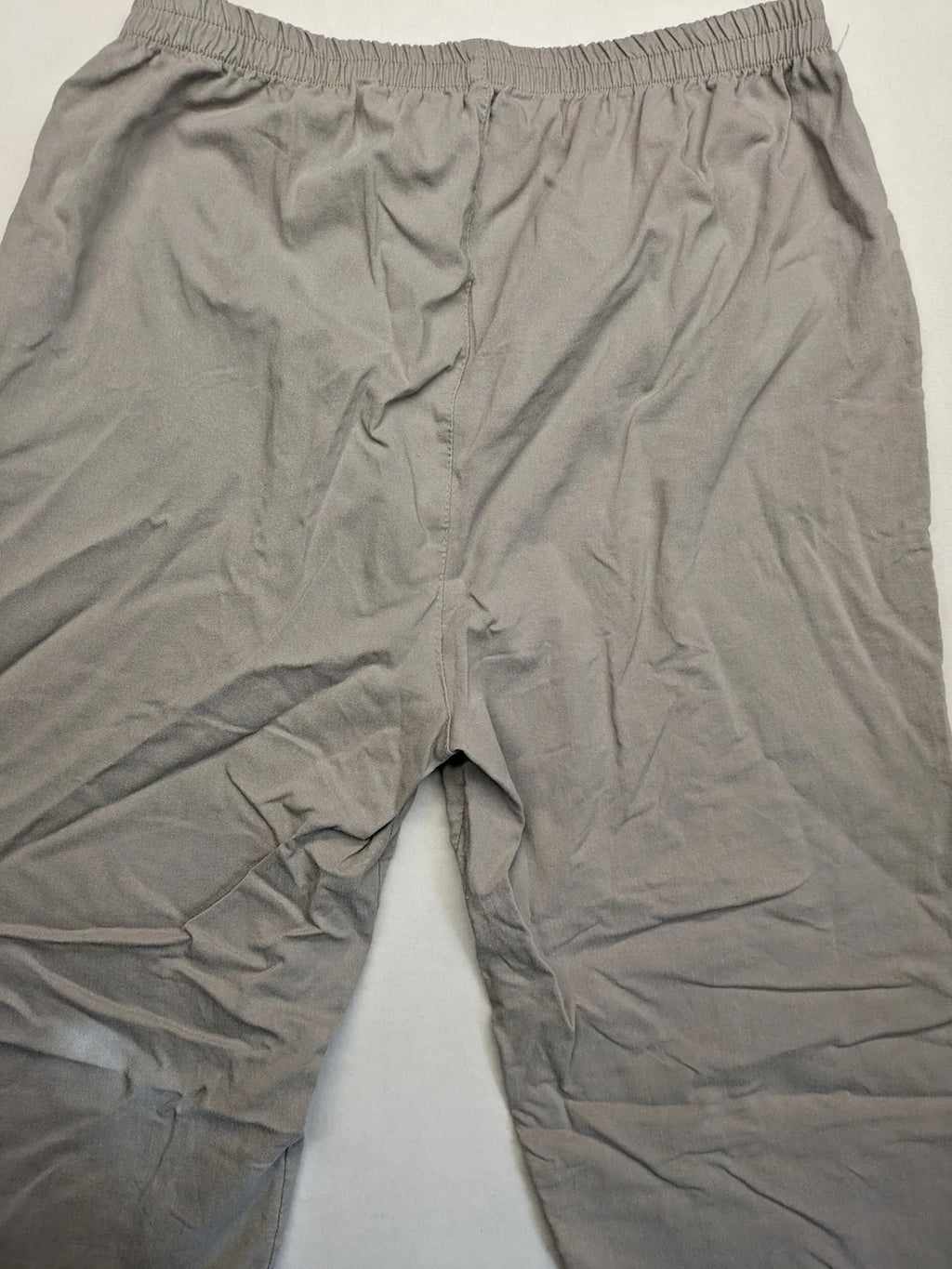 Cherry Berry khaki capri pants with elastic waistband and decorative buttons, featuring logo and zip pockets.