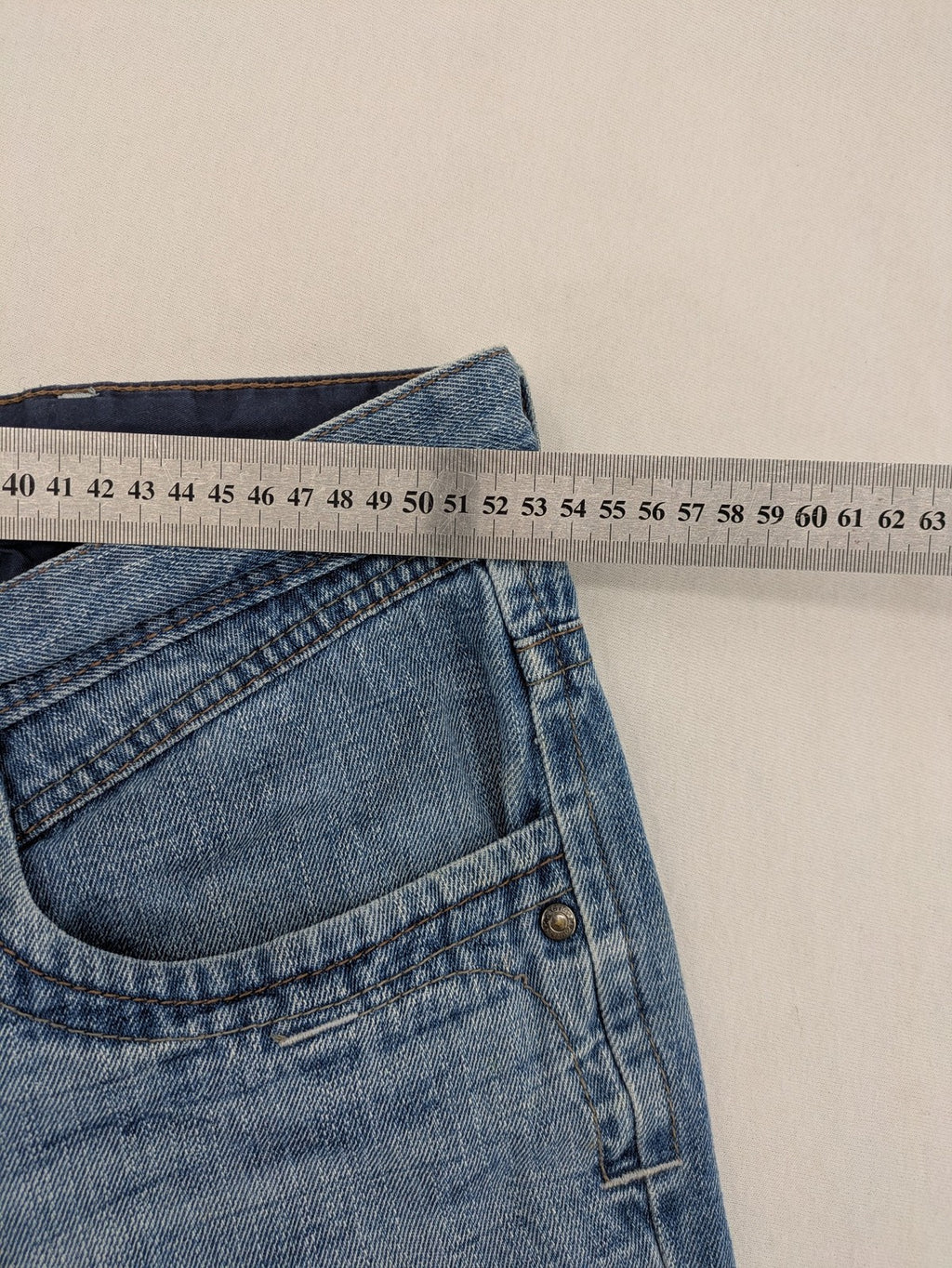 C&A blue straight jeans 5-pocket style with logo and button closure.