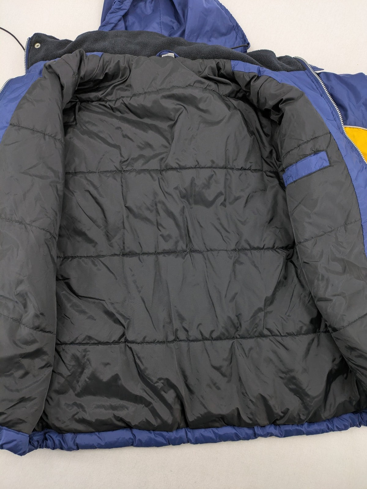 Shamp navy and yellow vintage ski jacket and pants set with retro design.