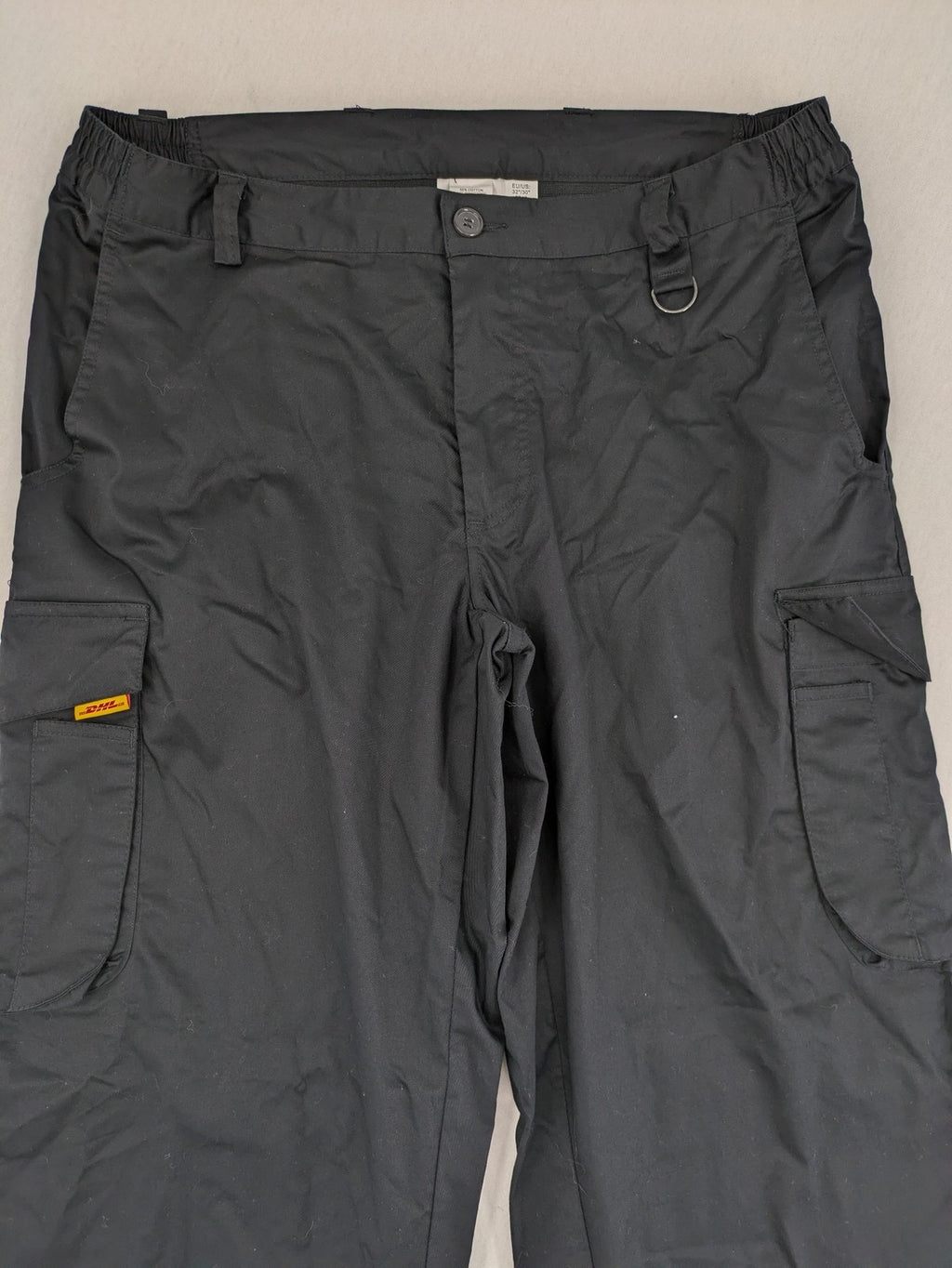 DHL grey cargo pants with iconic logo and multiple pockets, made from stretch cotton.