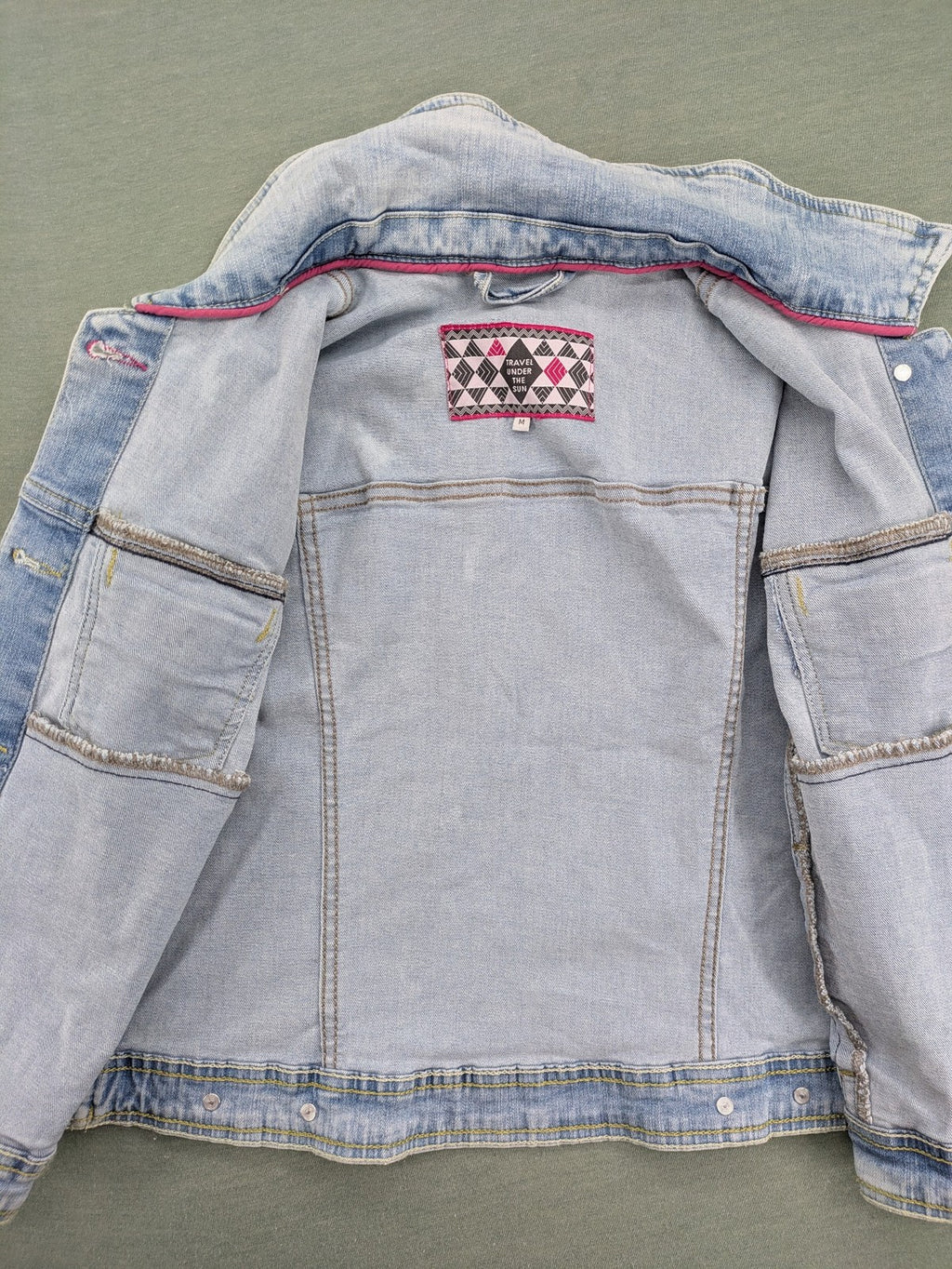 hle blue denim jacket lightwash classic trucker style with pink collar trim and pockets