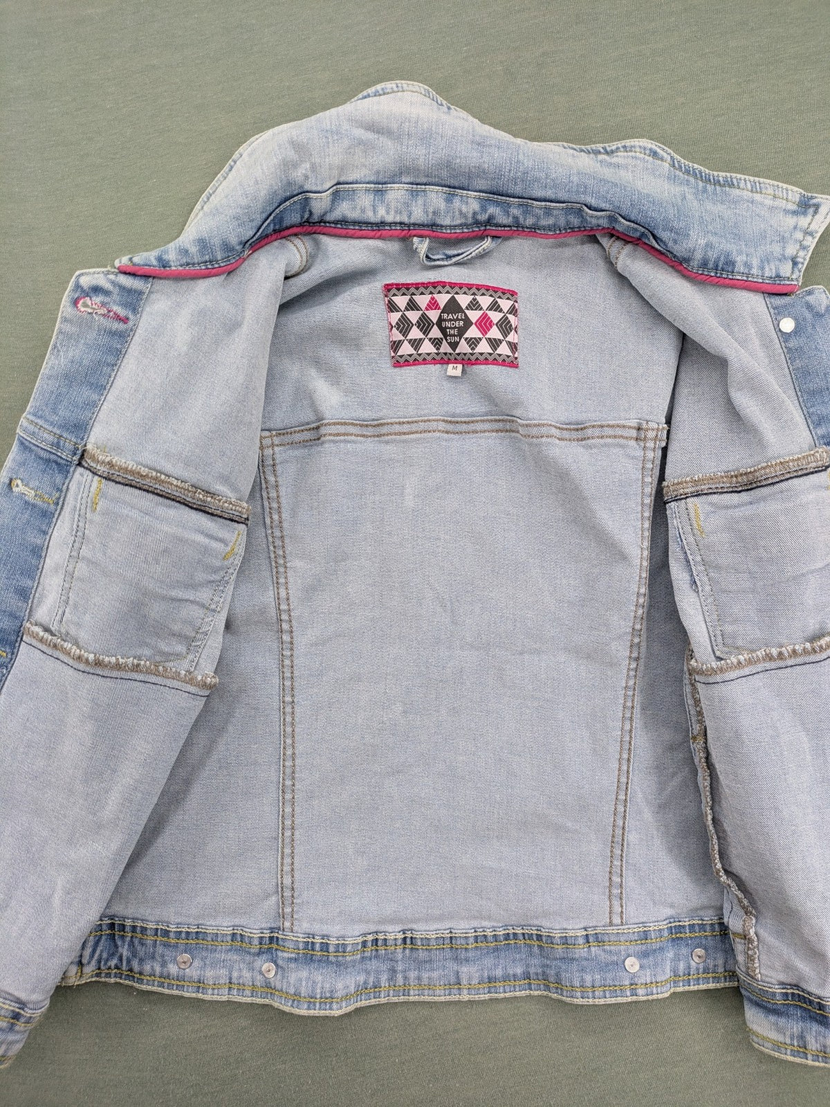 hle blue denim jacket lightwash classic trucker style with pink collar trim and pockets