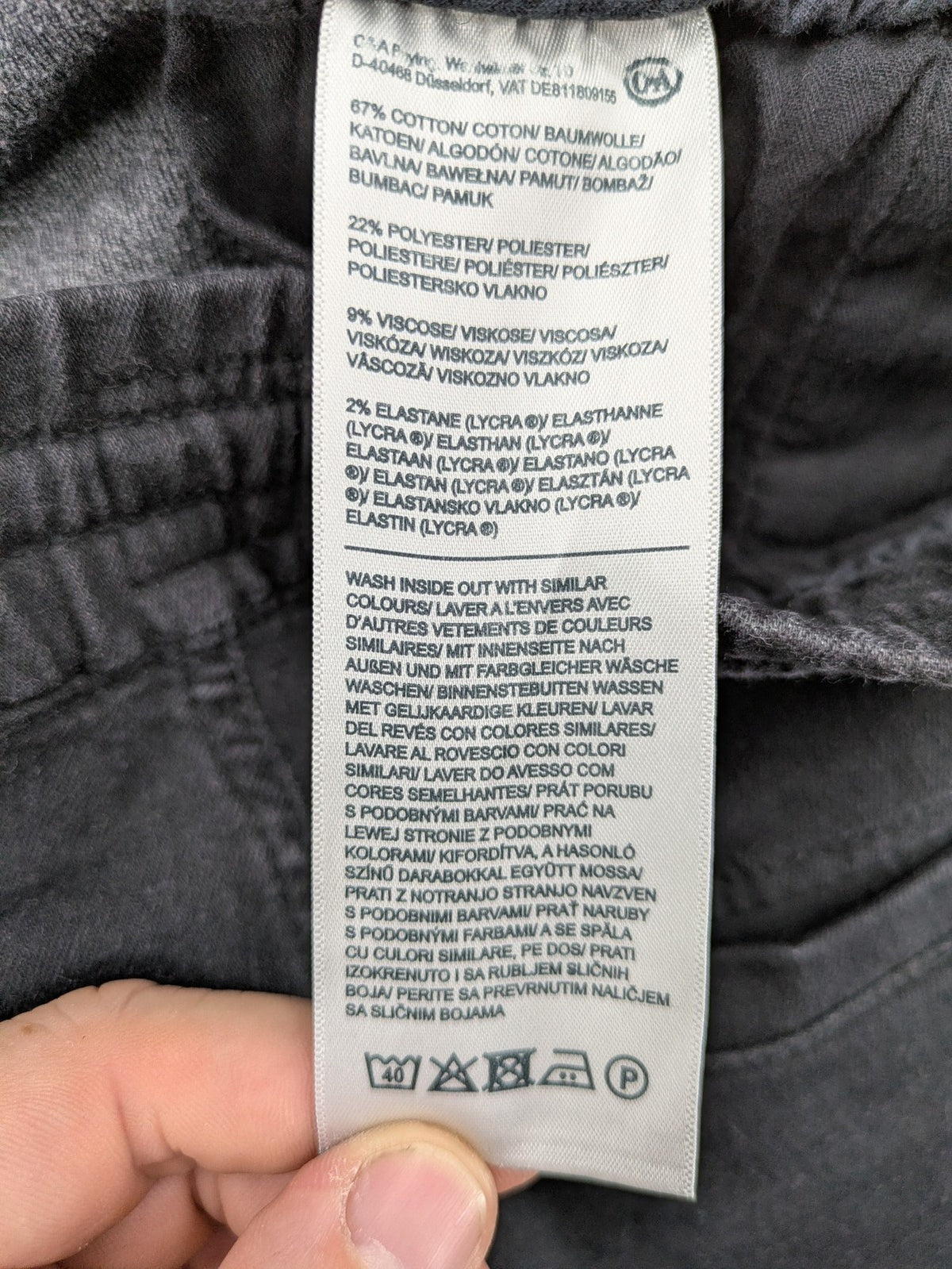 C&A grey jogger pants with elastic cuffs, drawstring waist, and multiple pockets.