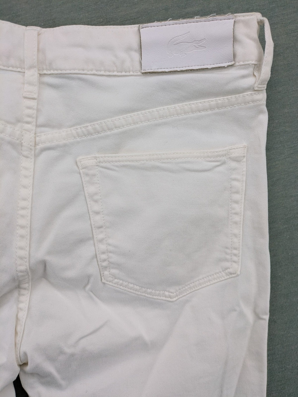 Lacoste white straight jeans high rise slim fit with logo and stretch denim material.
