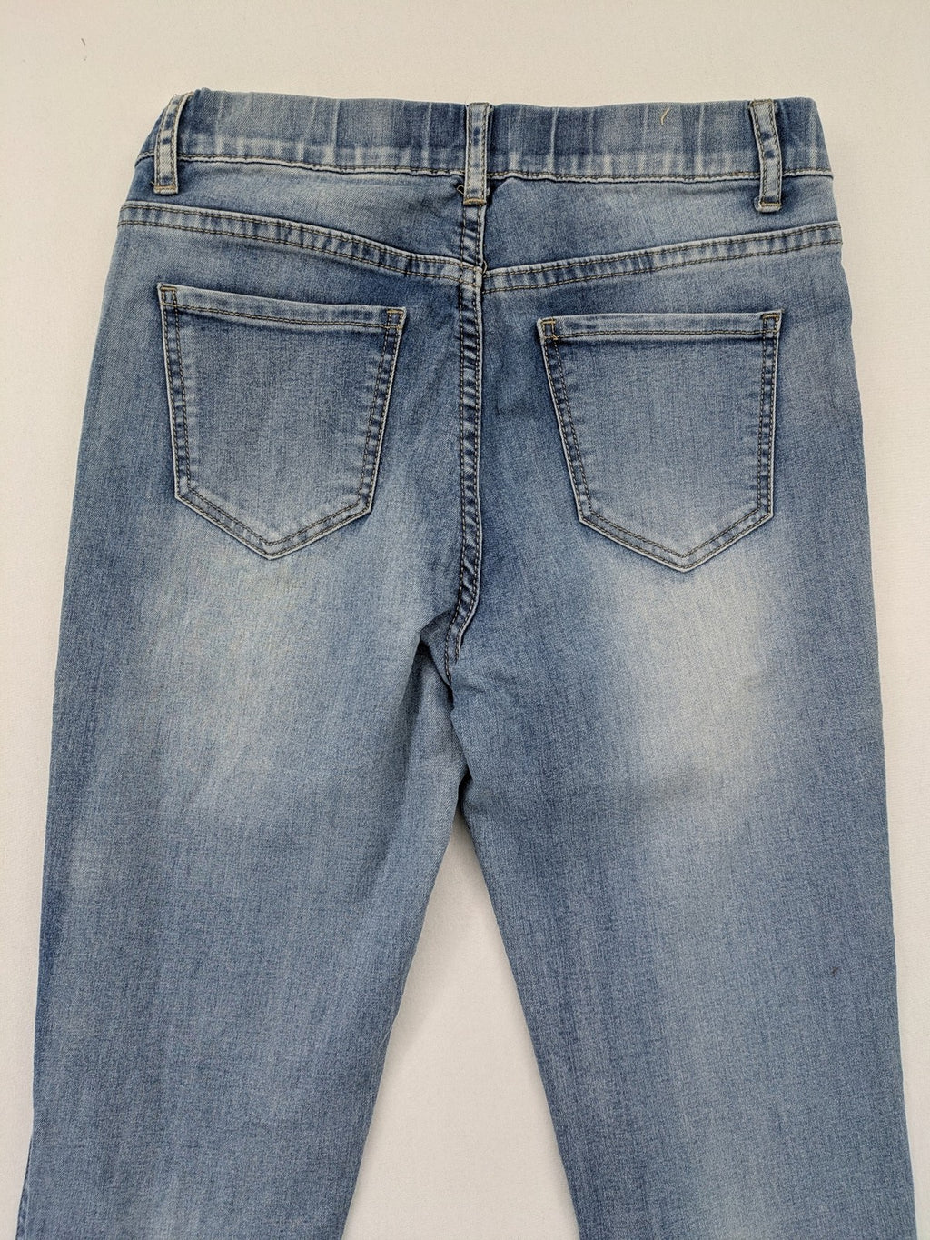 Miss Bonbon blue skinny jeans jeggings with elastic pull-on waistband and light wash.