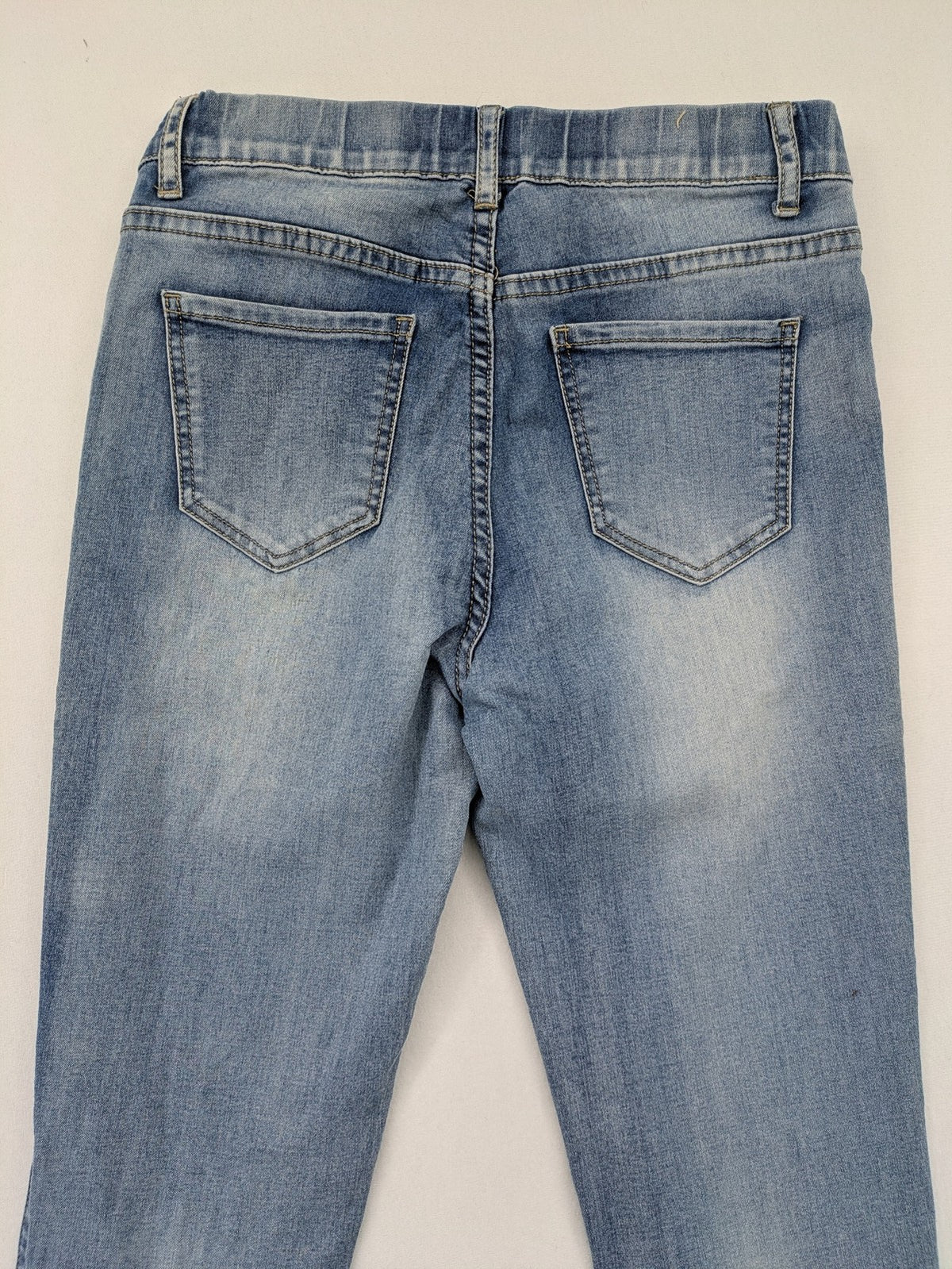 Miss Bonbon blue skinny jeans jeggings with elastic pull-on waistband and light wash.