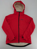 Pinea red softshell jacket with adjustable hood and fleece lining, multiple zippered pockets.