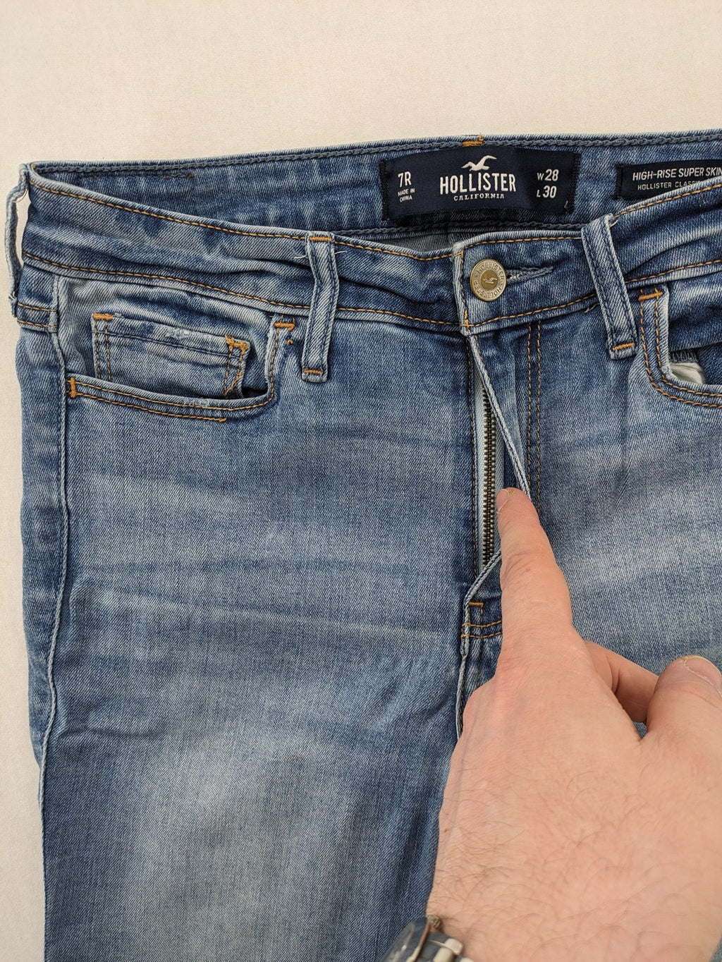 Hollister blue high rise super skinny jeans with frayed hem and classic stretch denim.