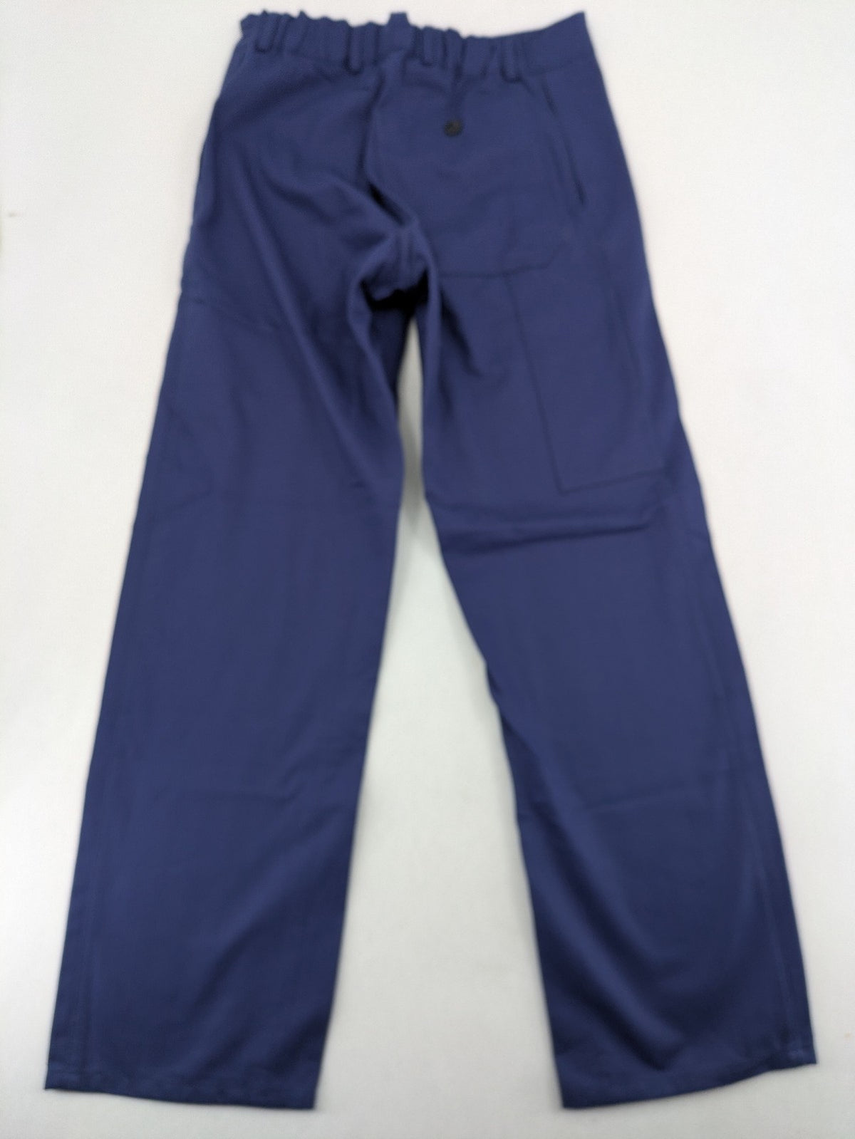 Uvex navy work trousers 100% cotton with button closure and belt loops.