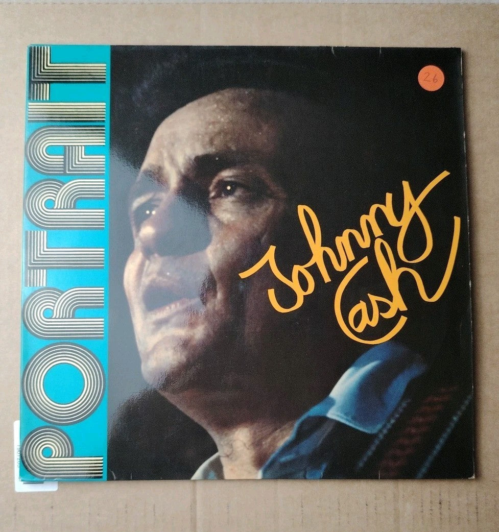 Johnny Cash blue vinyl record signed 12" LP with iconic music history.
