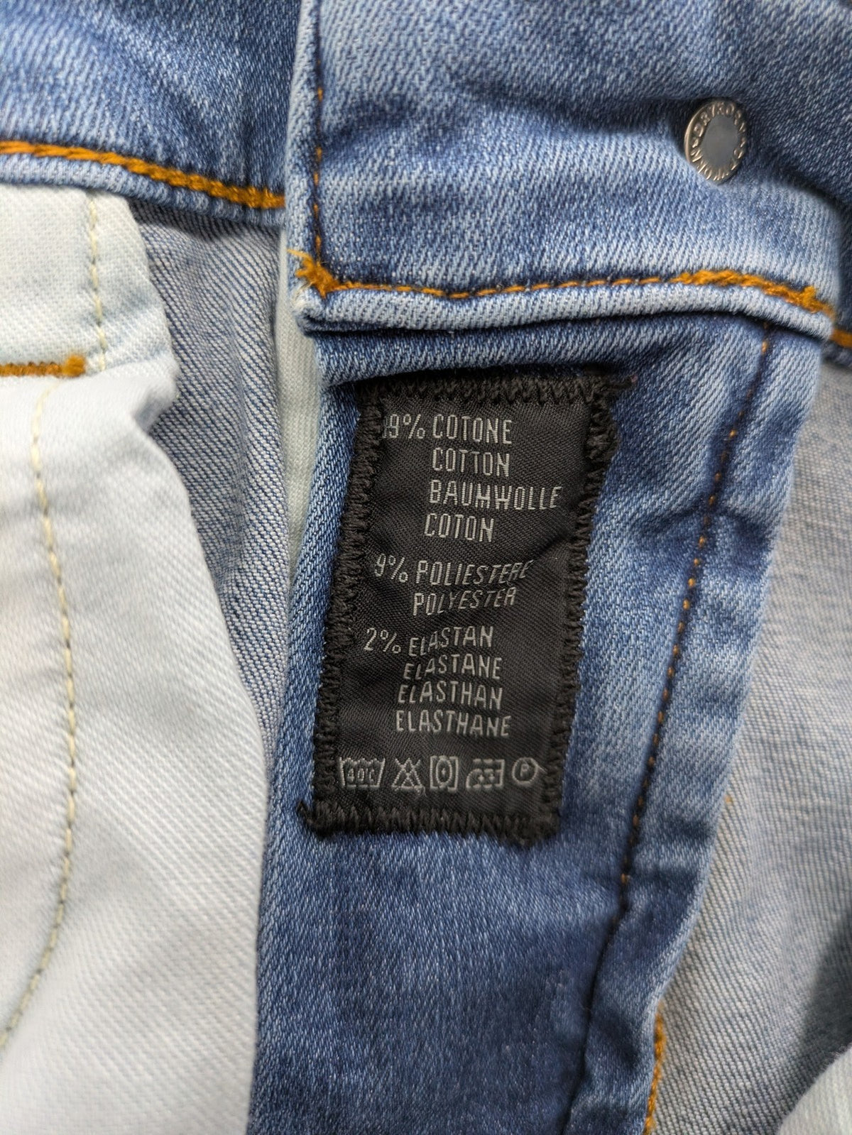 Drykorn blue straight jeans with stretch denim, classic fit, and logo patch on waistband.