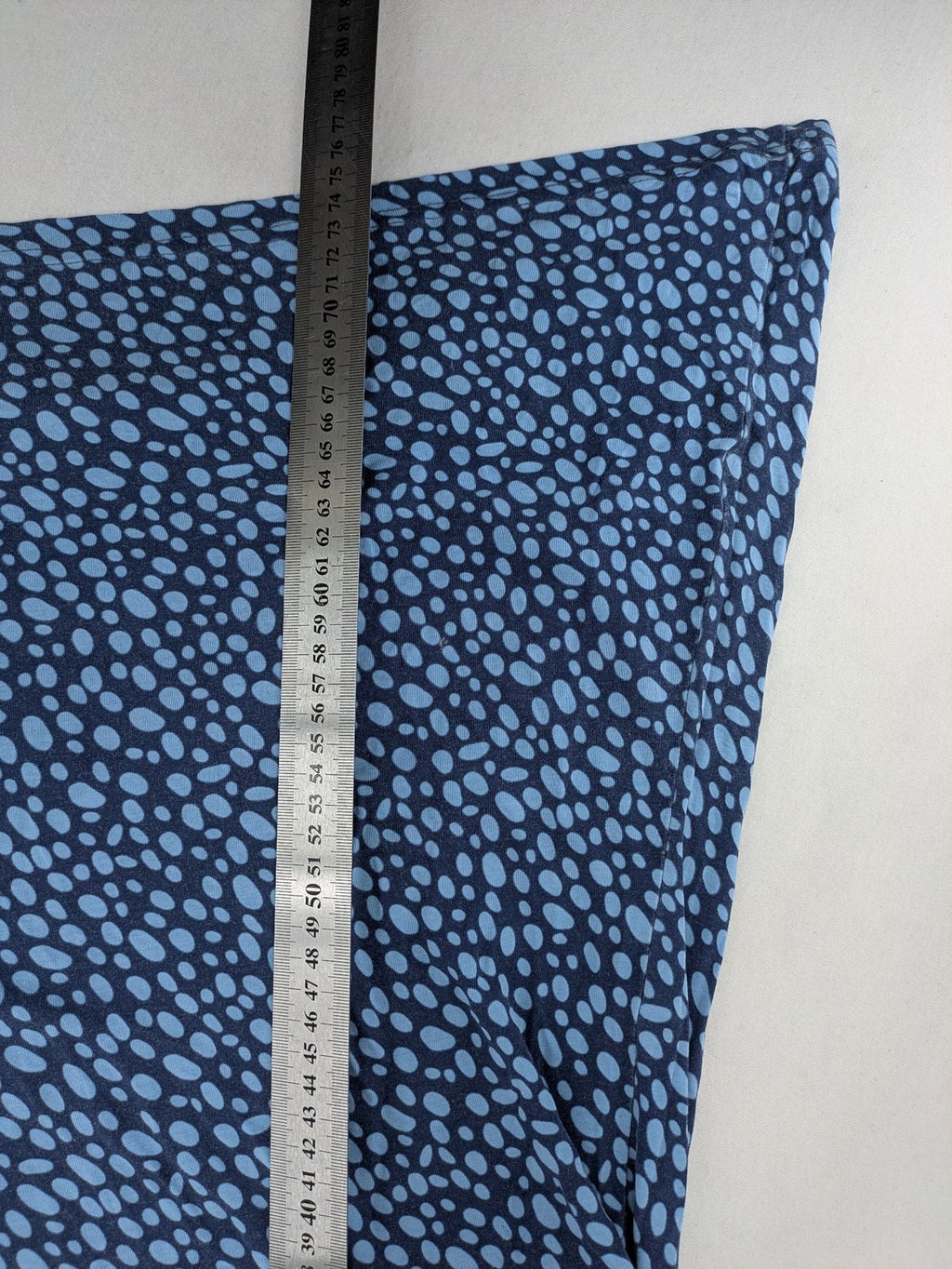 Ulla Popken blue tunic top with light blue polka dots and A-line cut.