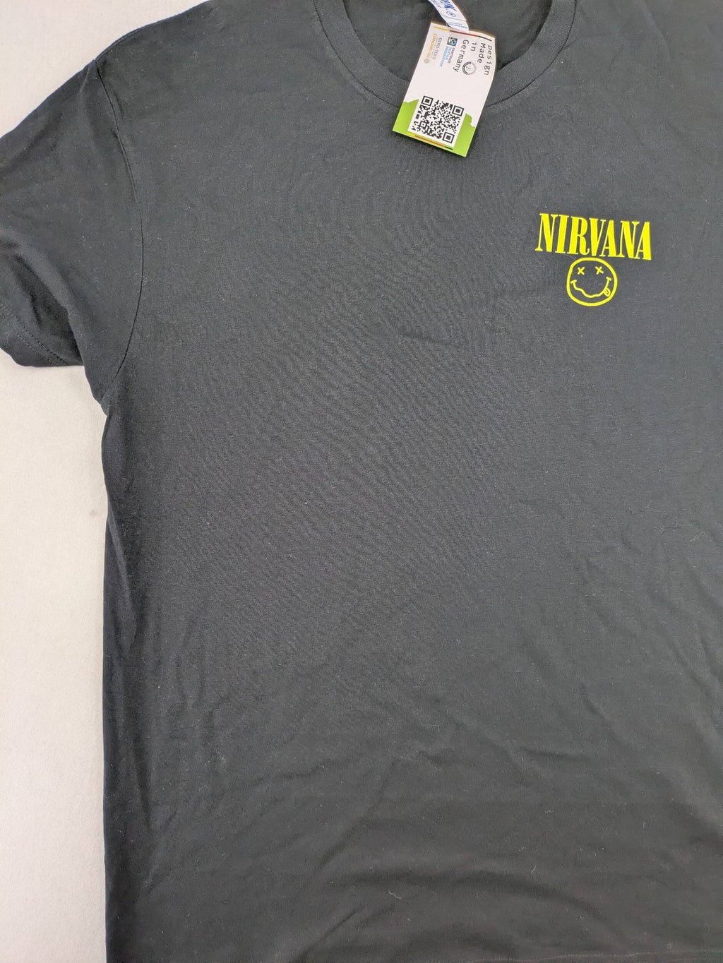 Smiley grey band t-shirt featuring yellow Nirvana smiley face logo on chest.