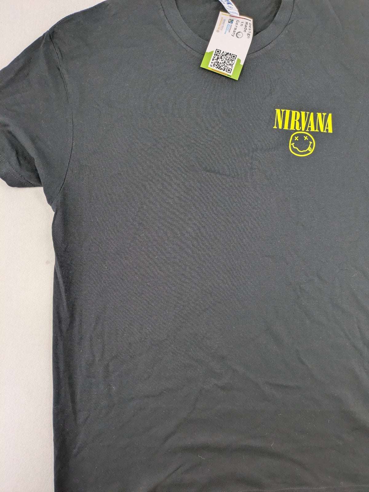 Smiley grey band t-shirt featuring yellow Nirvana smiley face logo on chest.