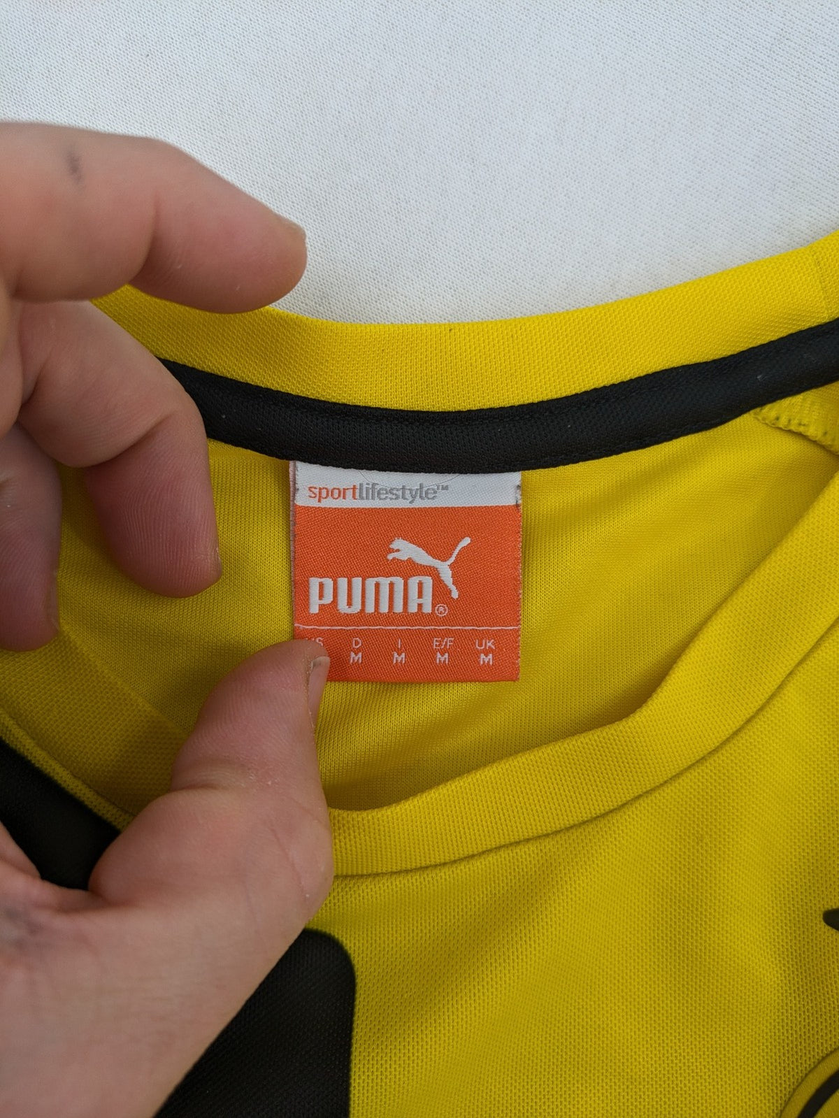 Puma black and purple soccer uniform with yellow accents, Reus #11, "Derbysieger 2015" print.