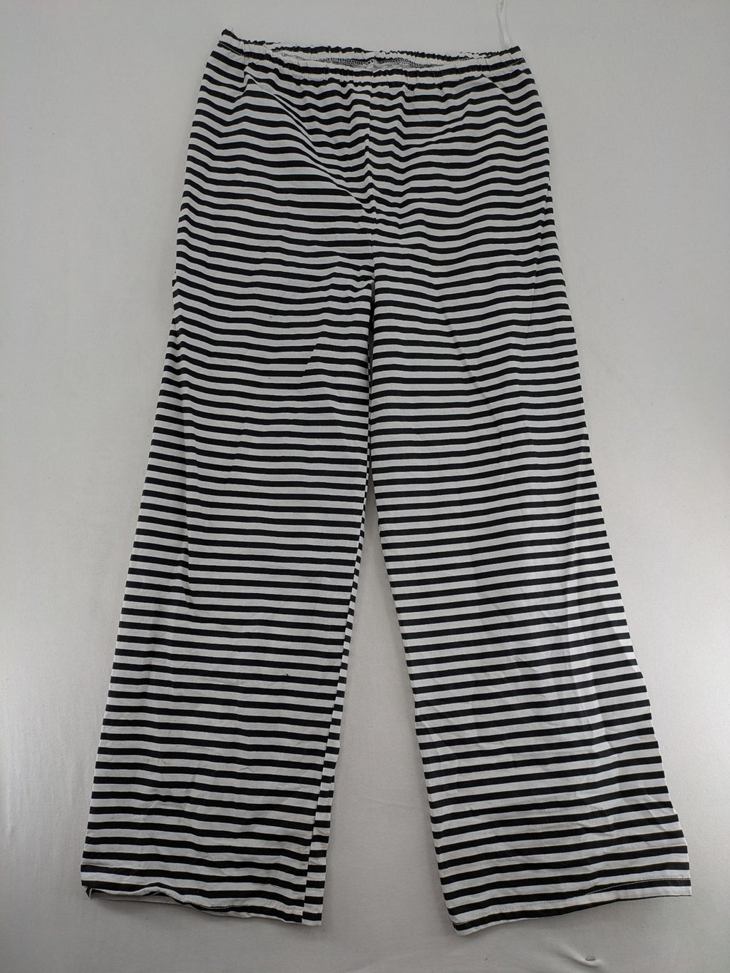 Rubie's costume set black and white striped with prisoner number patch on chest.