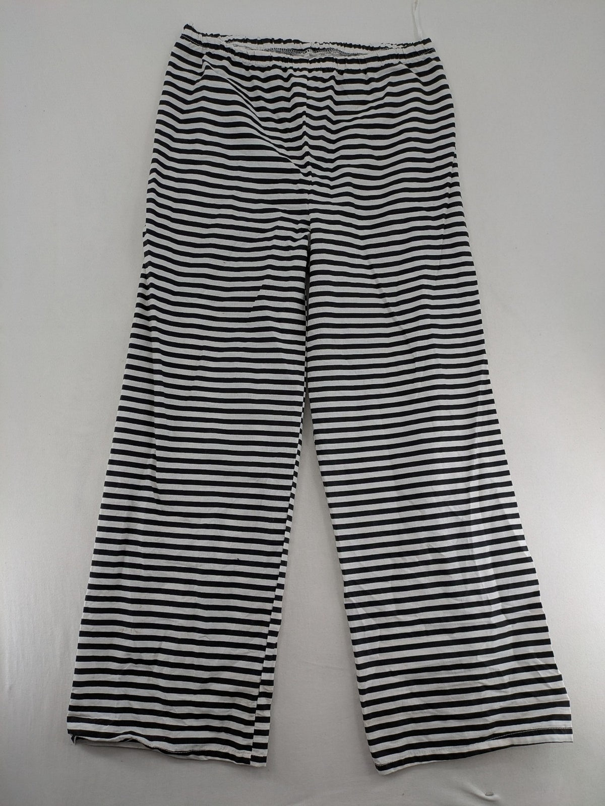 Rubie's costume set black and white striped with prisoner number patch on chest.