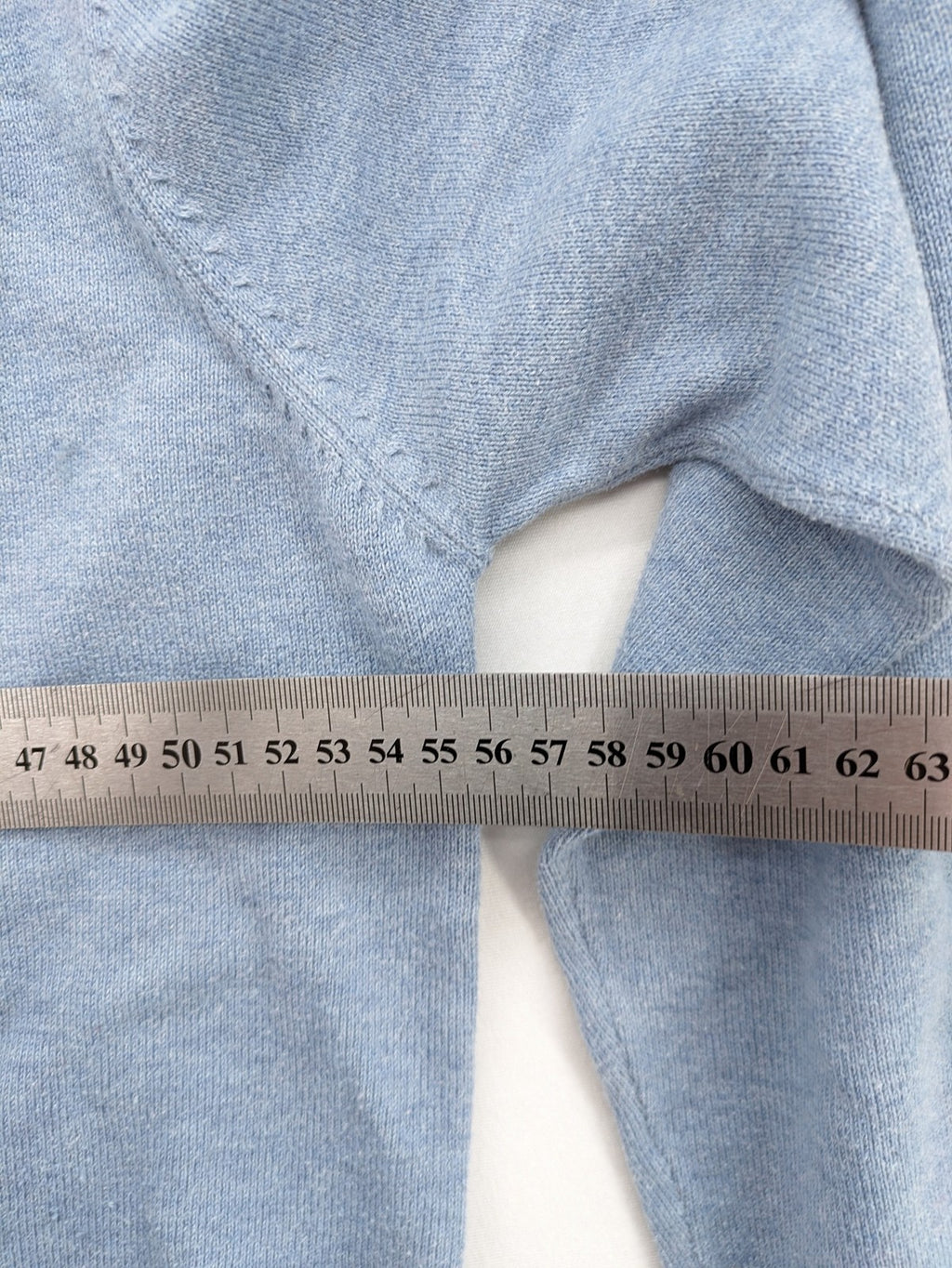 BRAX blue turtle neck jumper with V-neck and subtle "X" logo embroidery.