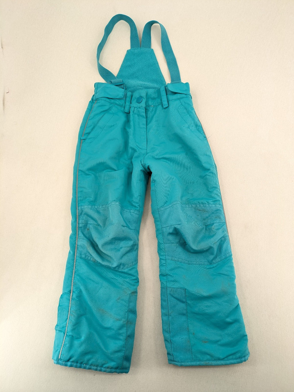 Topolino blue and turquoise snow pants with adjustable straps and fleece-lined bib.