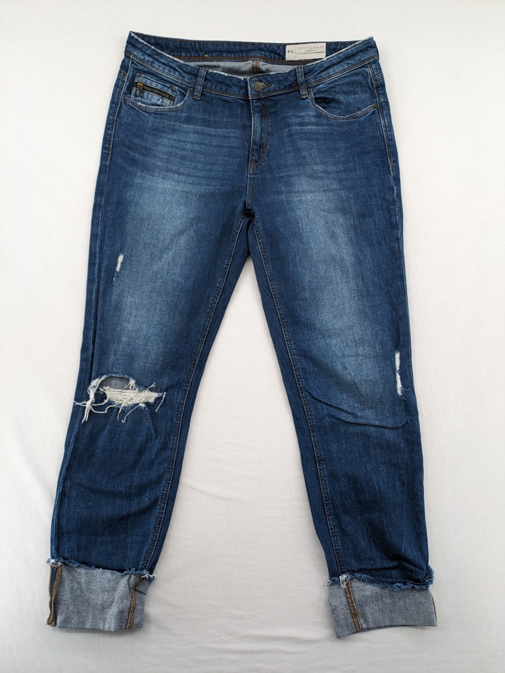 Esprit blue straight leg jeans with ripped knee details and rolled hem.