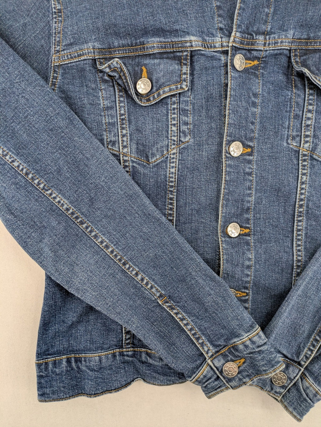 Best Connections cream denim jacket classic design with button placket and two chest pockets.
