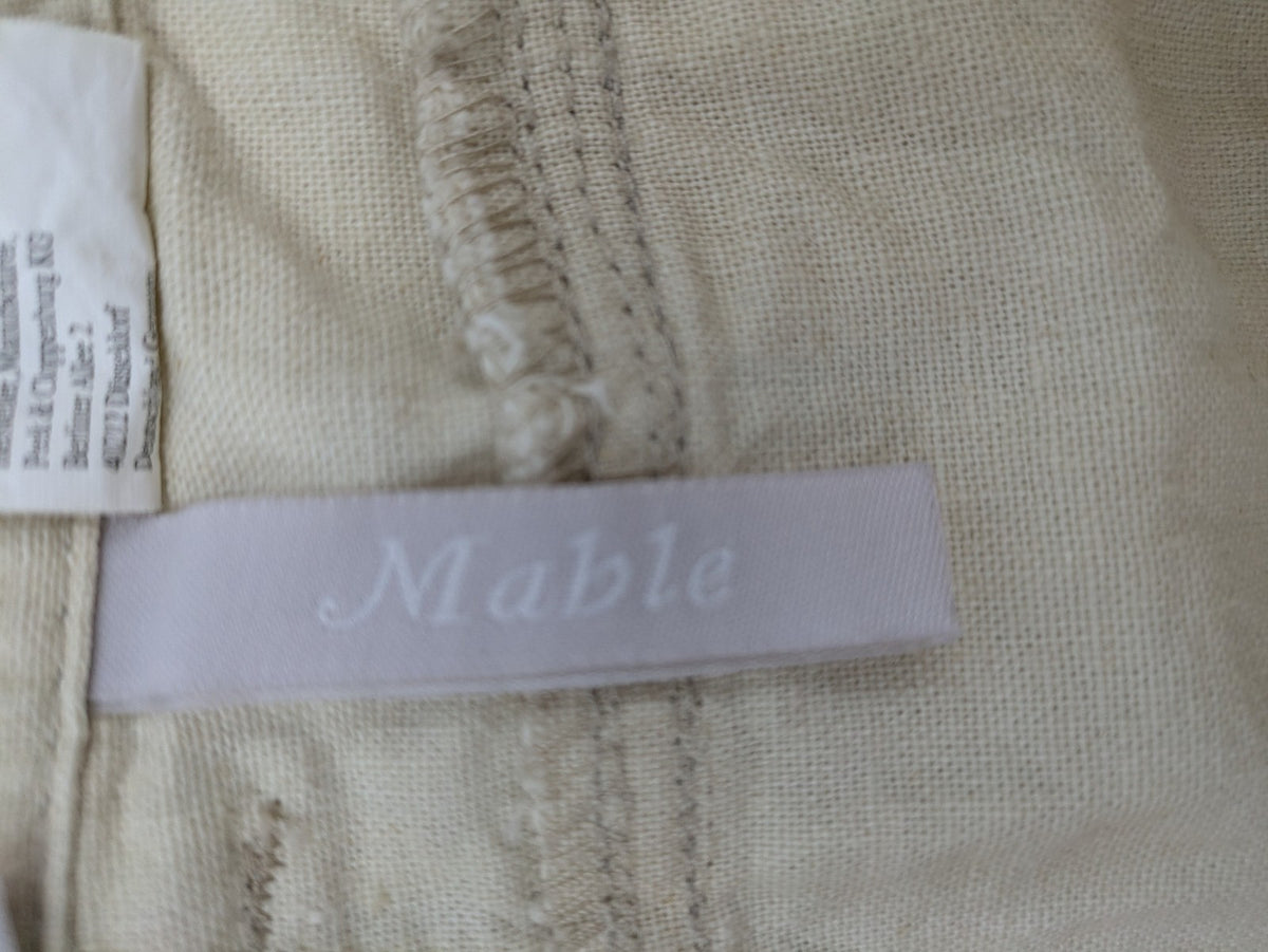 Marco Pecci beige capri pants with prominent seam details and practical pockets.