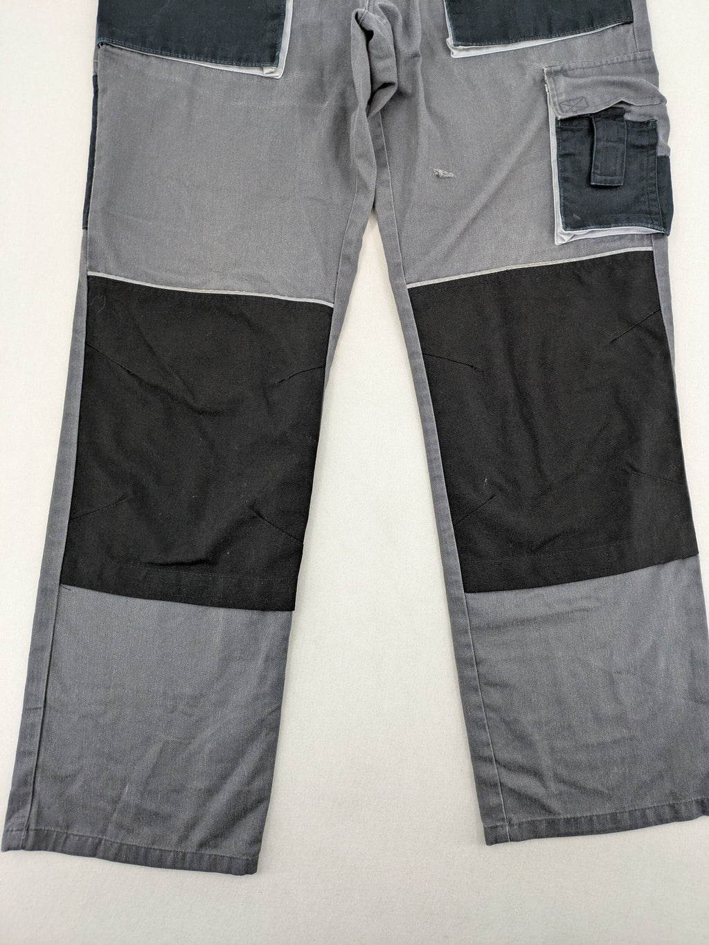 Watsons grey and black hunting tactical pants with Cordura reinforcements and elastic waistband.