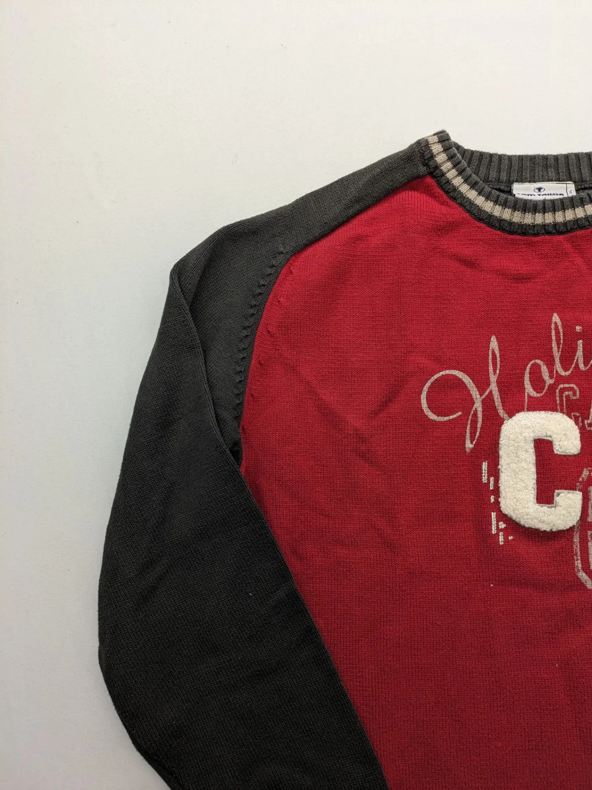 Tom Tailor black and red turtle neck jumper with "Holiday Camp" chenille patch and striped cuffs.