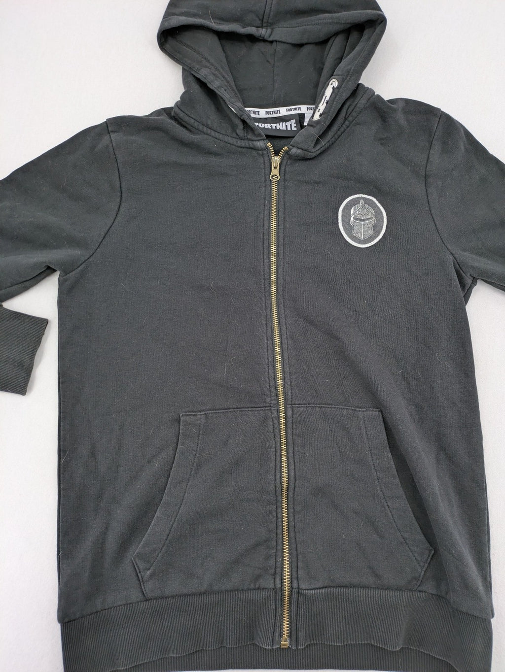 Fortnite black zip-through hoodie with logo on sleeves and Black Knight patch on chest.
