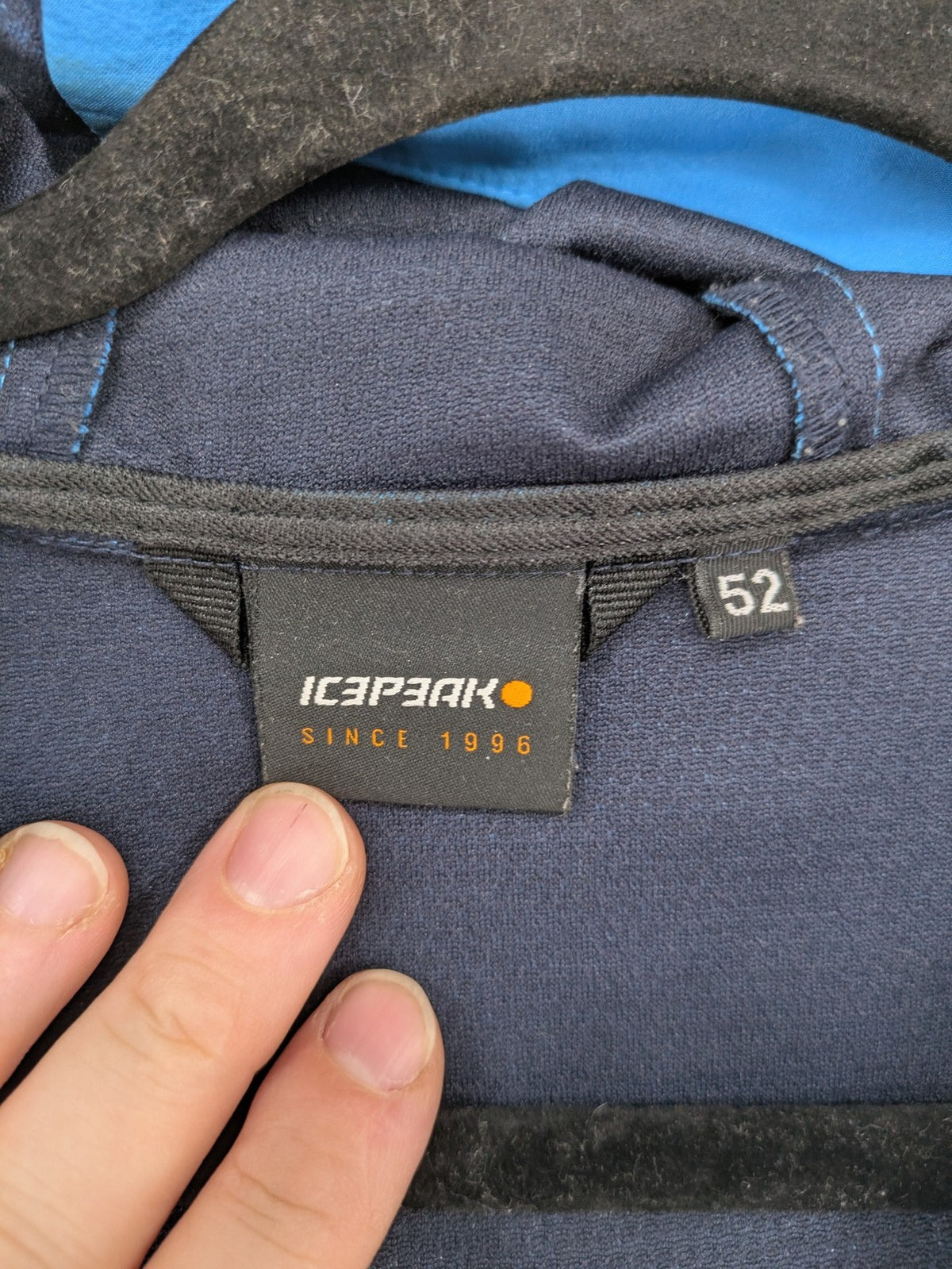 Icepeak blue softshell jacket colorblock design with zip pockets and logo details.