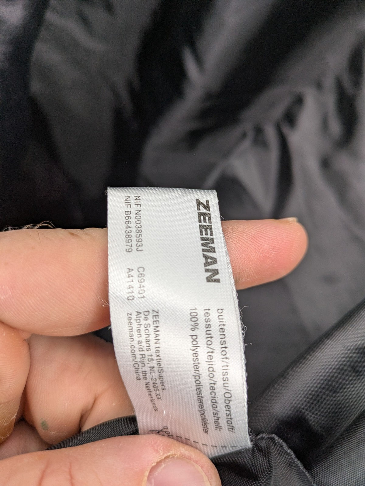 Zeeman grey quilted coat size 38 with hood and side snap buttons.