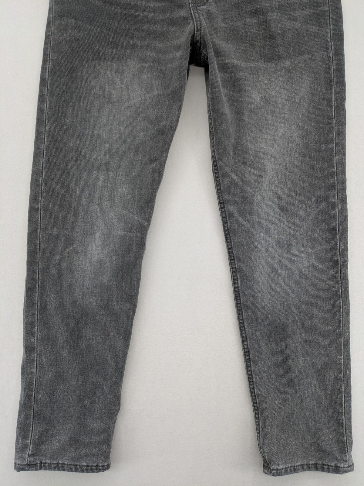 H&M grey jogger jeans with elastic waistband and drawstring, stylish washed look.