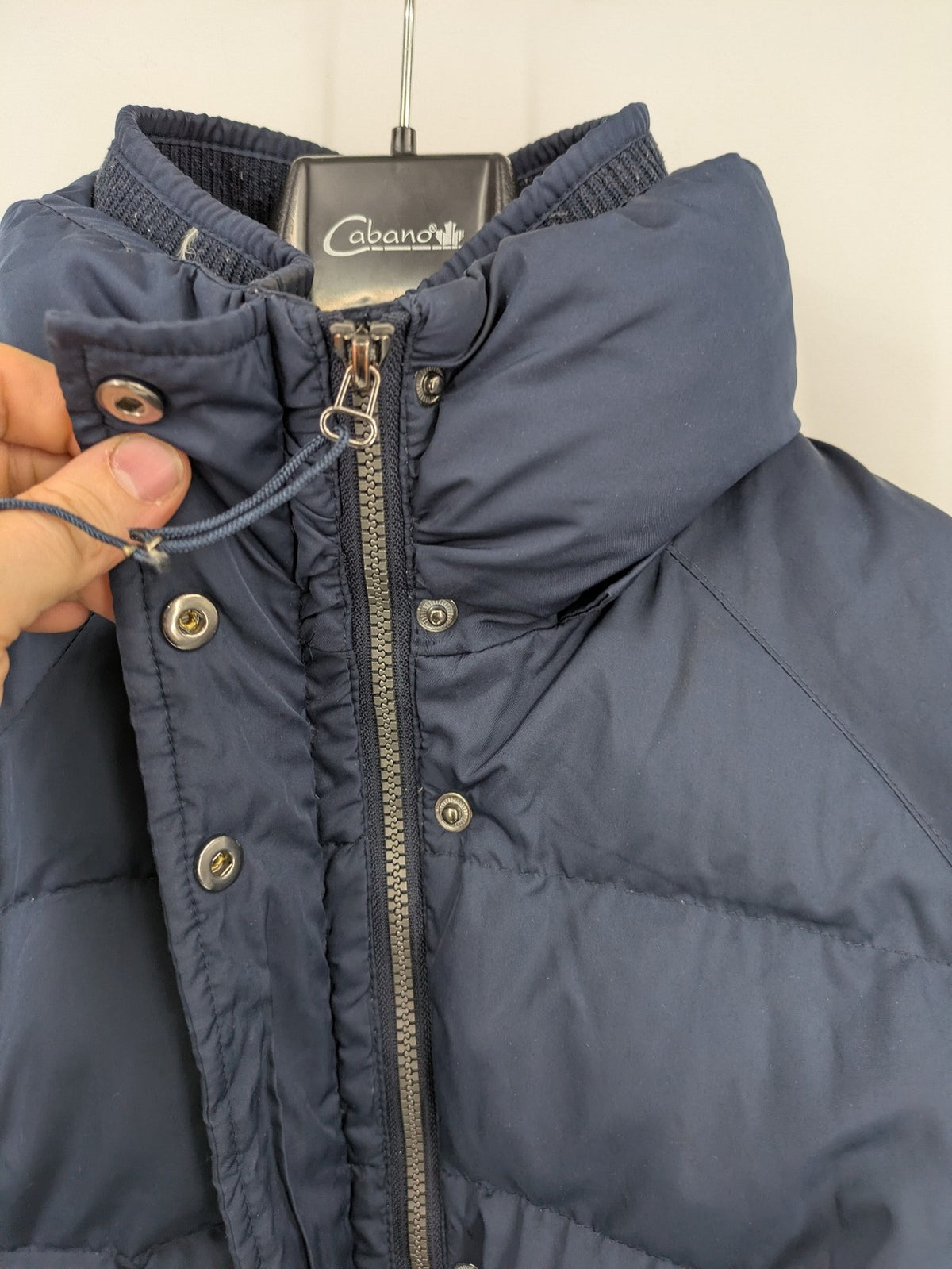Esprit navy puffer jacket with belt, high collar, ribbed inner lining, and button placket.